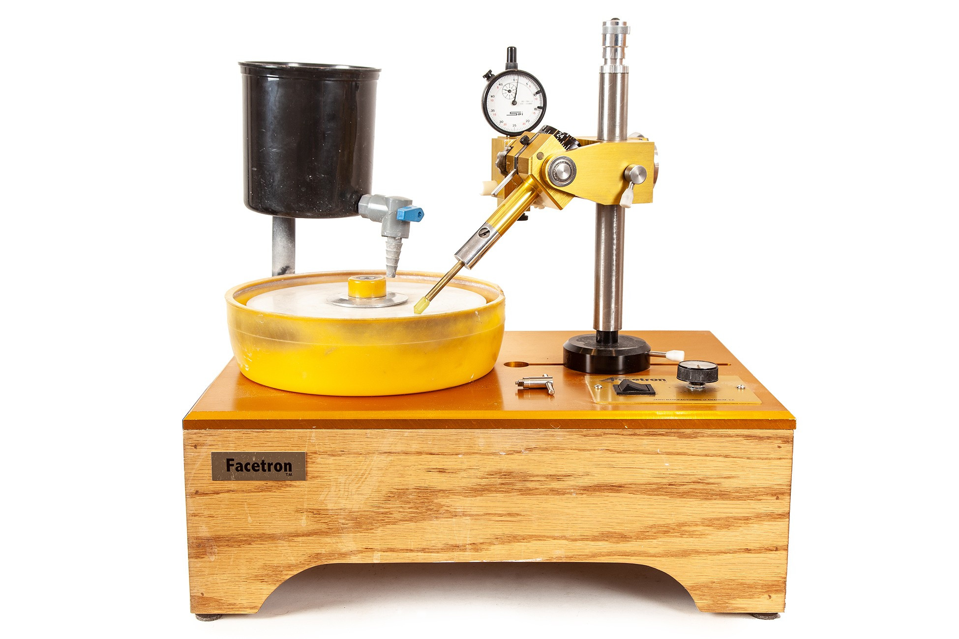 a facetron faceting machine: a stained pine box with a yellow table, and yellow parts