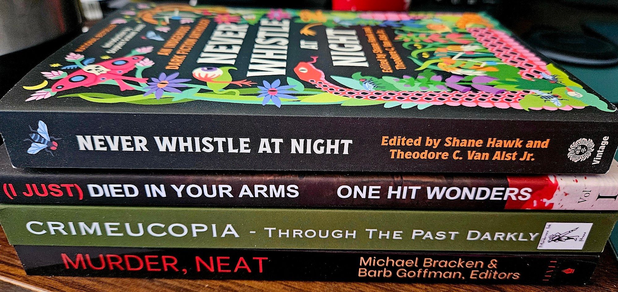 Image of a stack of 4 books, spines facing camera.

*Never Whistle at Night, edited by Shane Hawk and Theodore C. Van Alst Jr.
*(I Just) Died in Your Arms: Crime Fiction Inspired By One-Hit Wonders, edited by J. Alan Hartman
*Crimeucopia: Through the Past Darkly from Murderous Ink Press
*Murder, Neat: A SleuthSayers Anthology, Edited by Michael Bracken and Barb Goffman