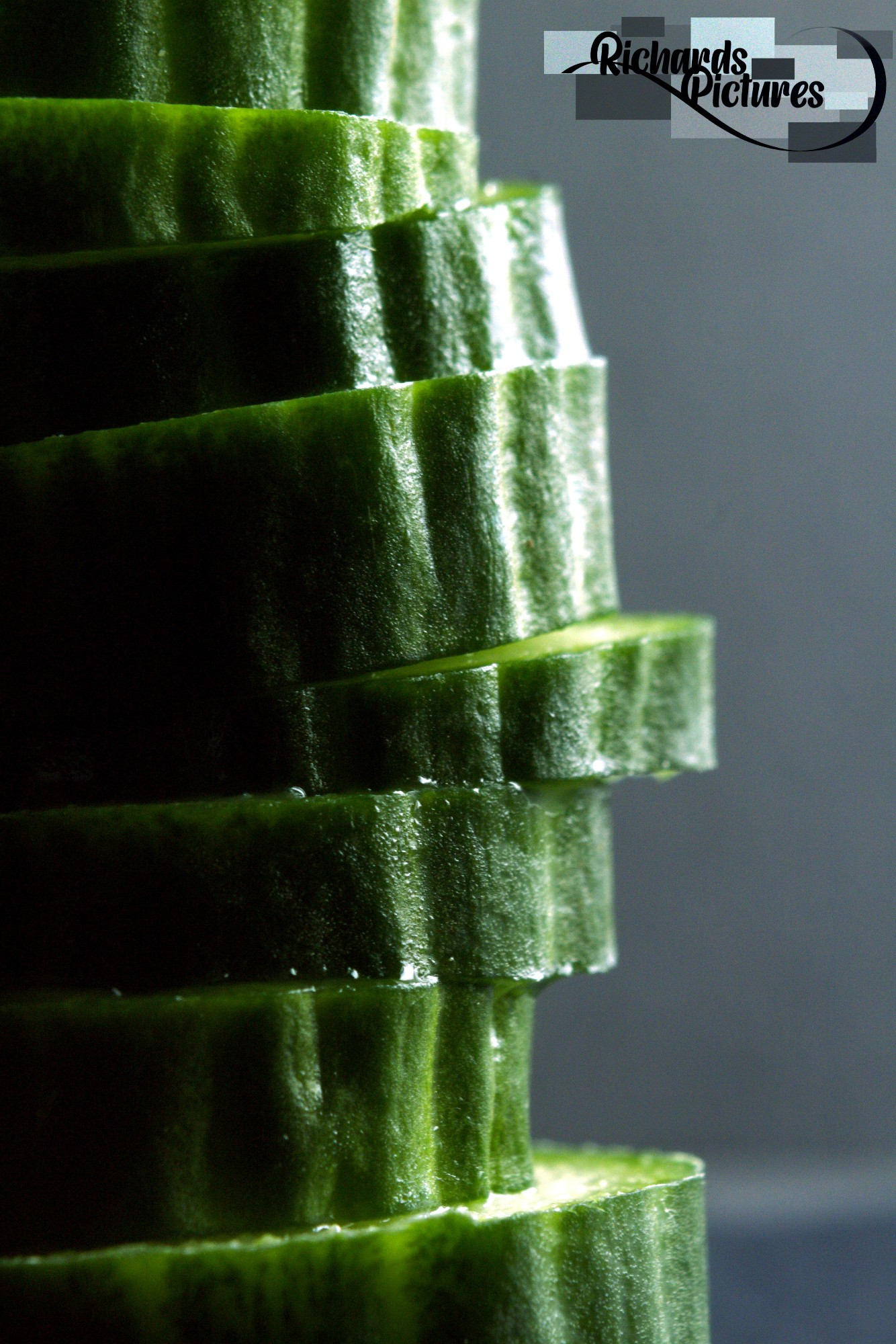 Close-up image of a stack of cucumber.
-Taken around 14:30
-Used a 31mm extension tube. 
-Adjusted contrast and lighting of the subjects. 
-Flipped the image.