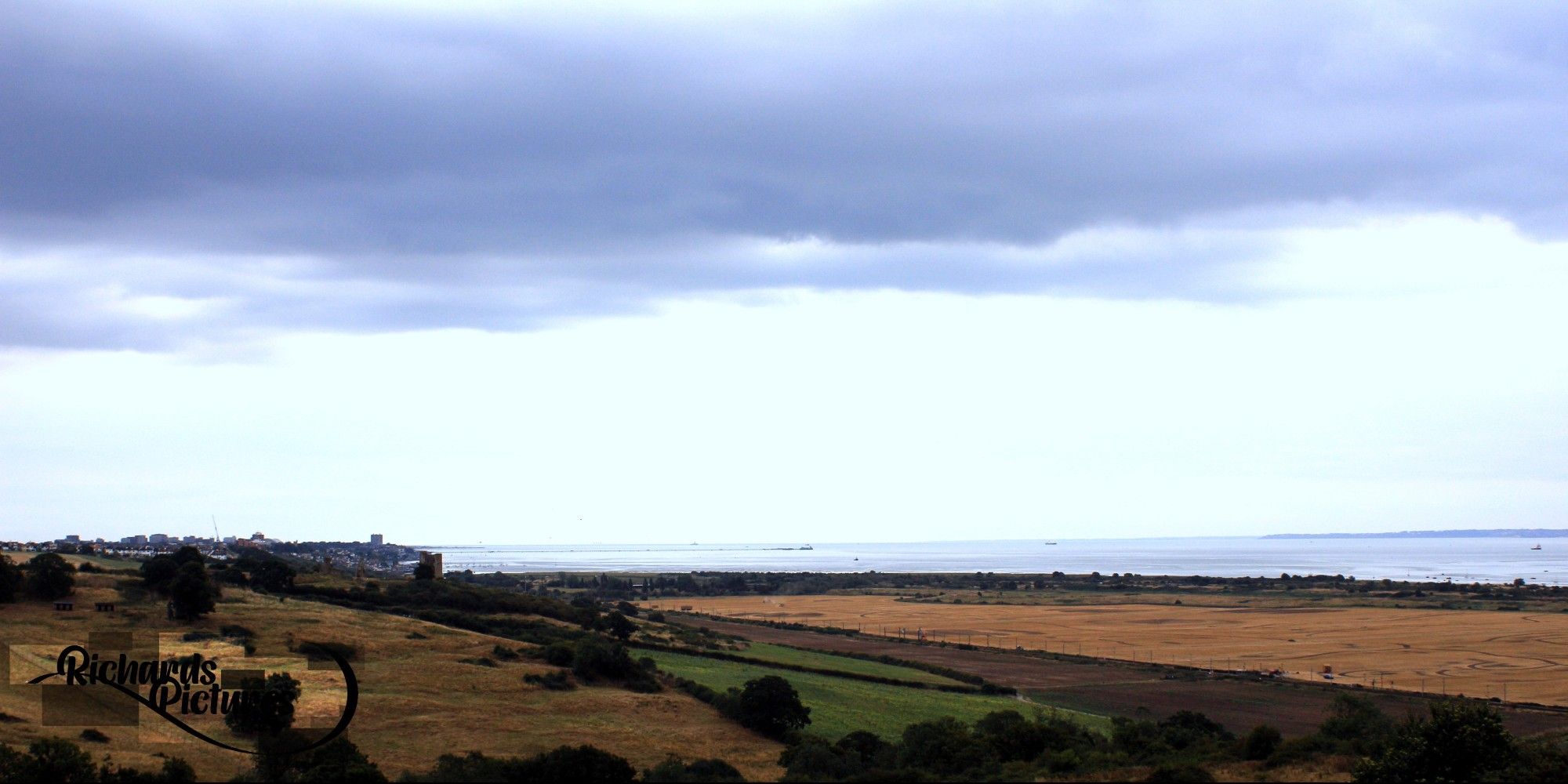 Overview of Hadleigh hill with a cloudy sky.