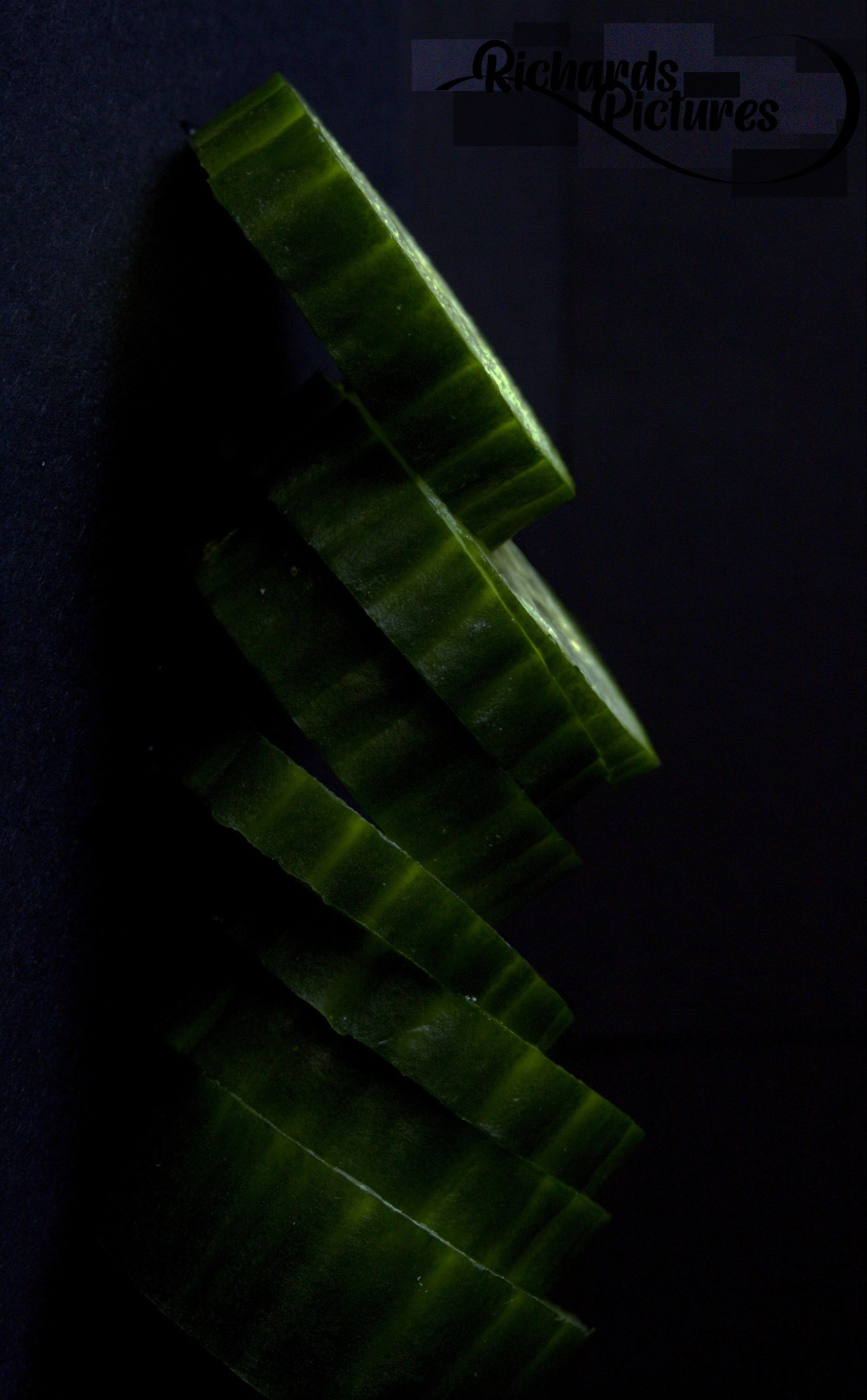 Close-up image of a stack of cucumber. 
-Taken around 15:00
-Used a 13mm extension tube. 
-Lowered contrast of the subject and rotated the image.