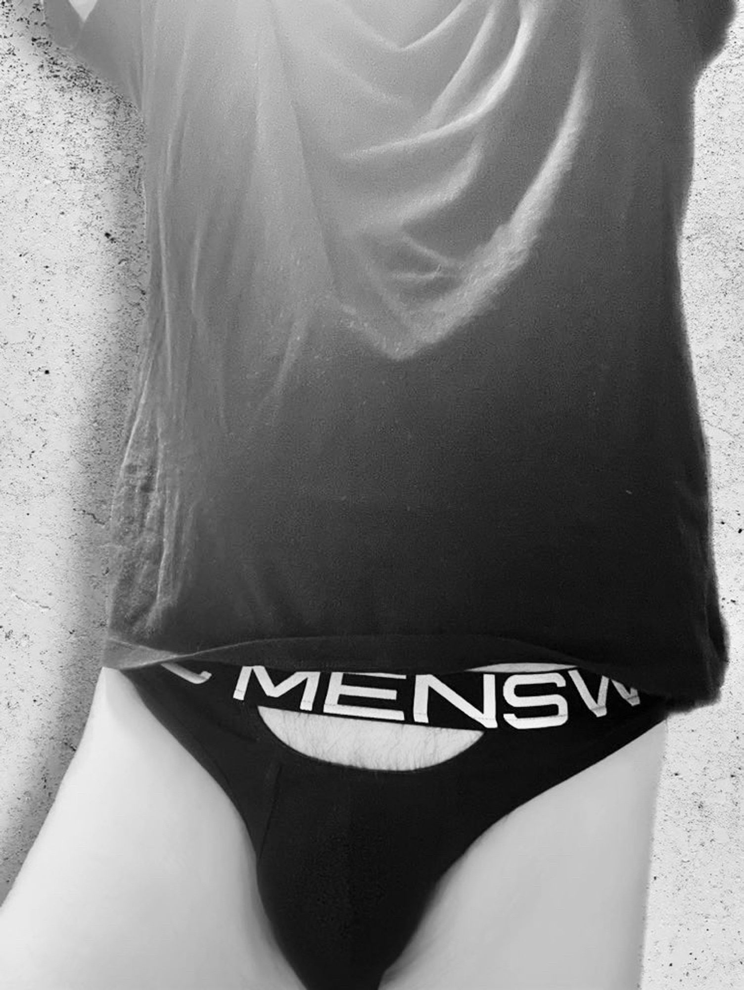 B&W photo wearing @Blancmenswear undies with peekaboo cutout and a T-shirt