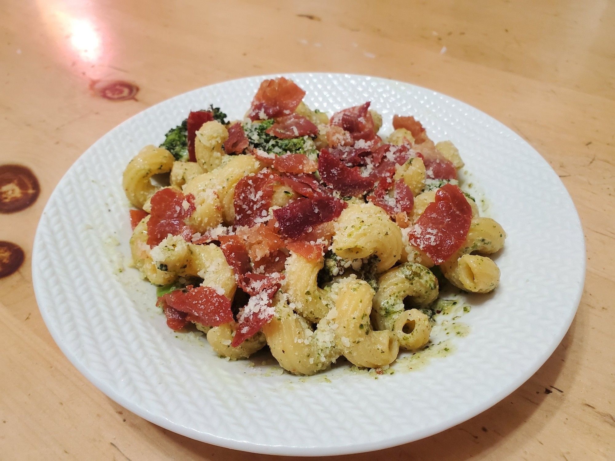 Lemon pesto cavatappi and broccoli topped with crispy prosciutto and parmesean.