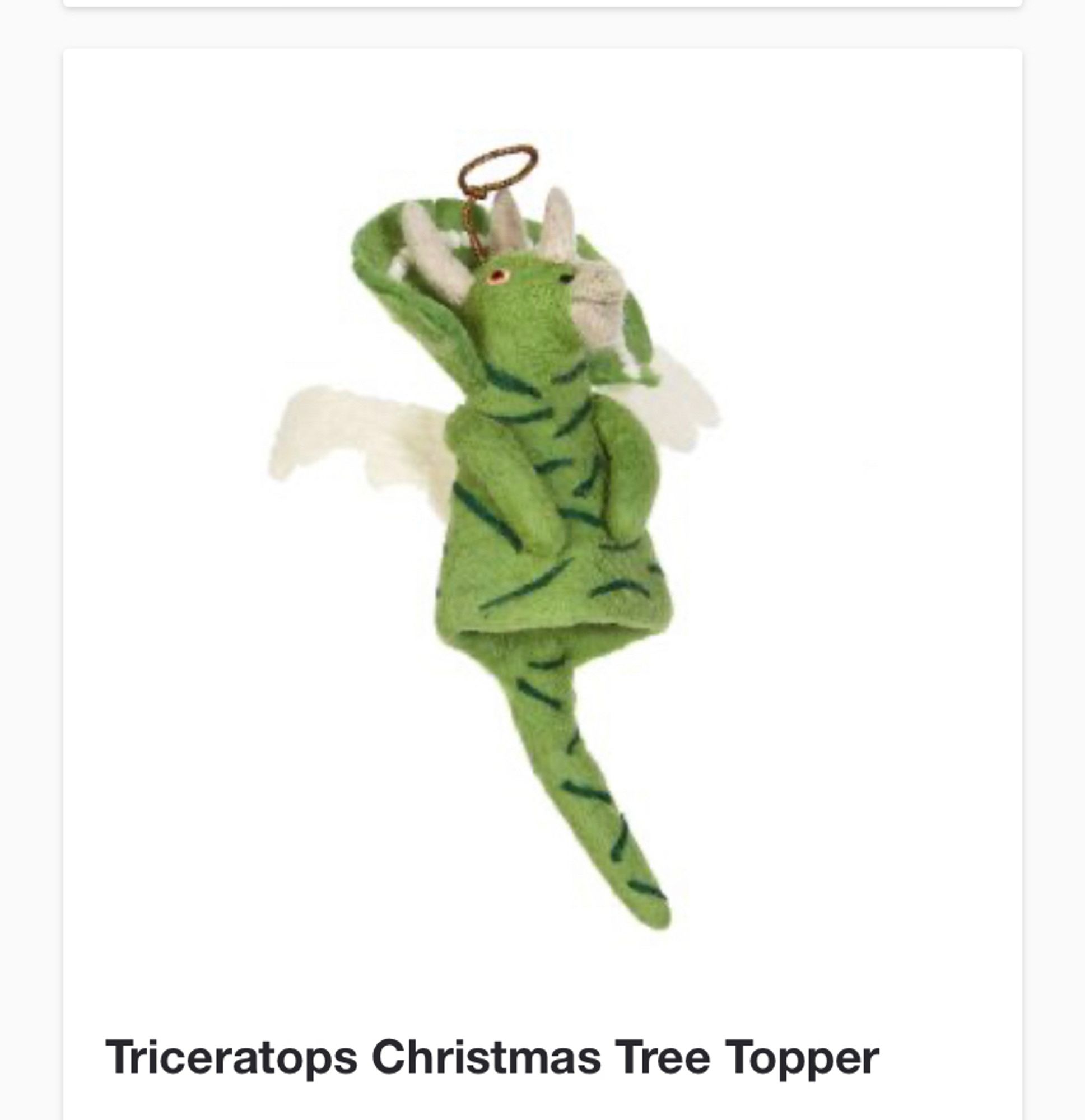 A Christmas tree topper, in light green felt. It’s a triceratops that looks like it’s wearing an Elvis-style jacket. It definitely has a halo.