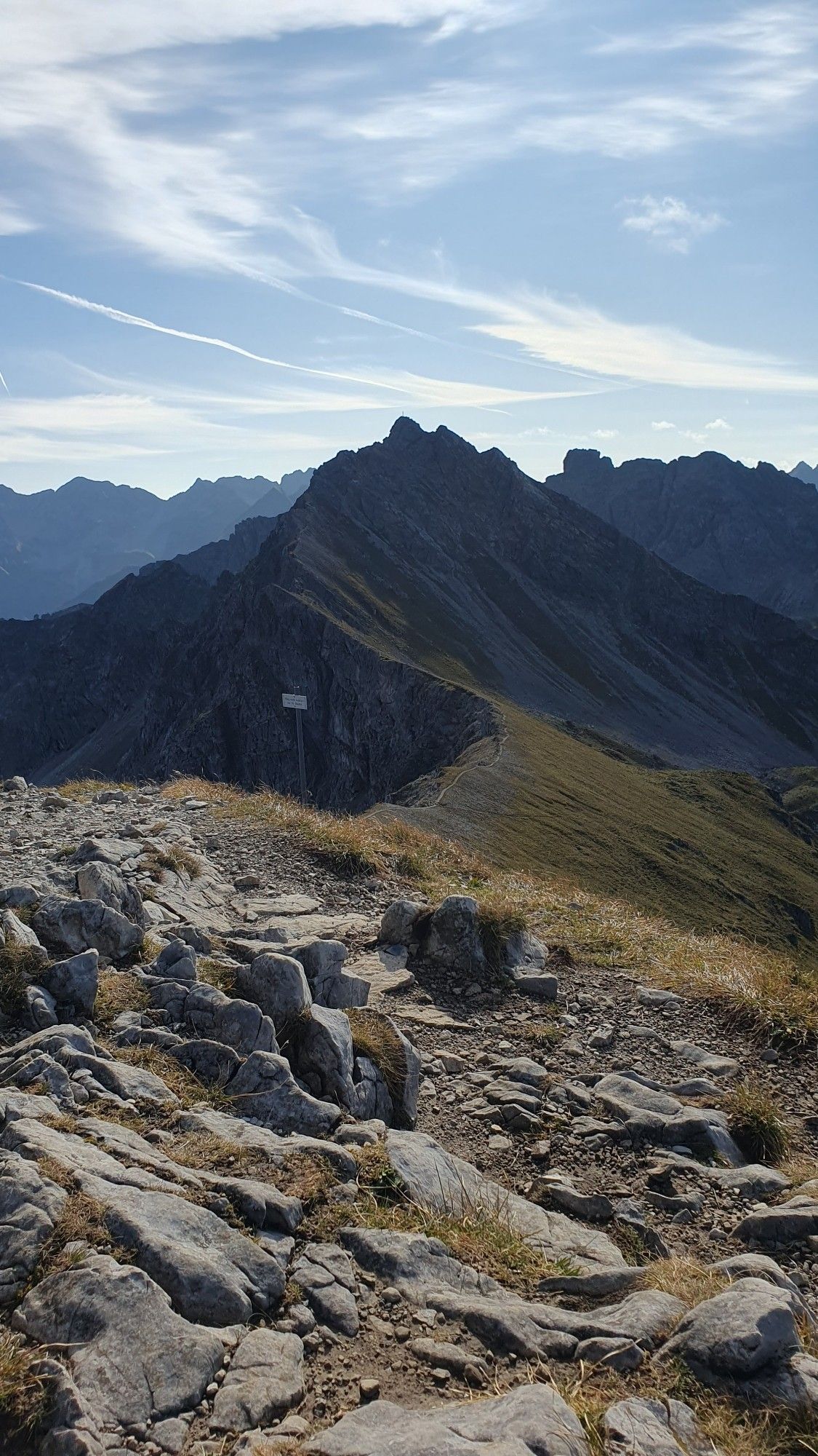 A mountain range with a distinct ridge across increasingly steep peaks ahead