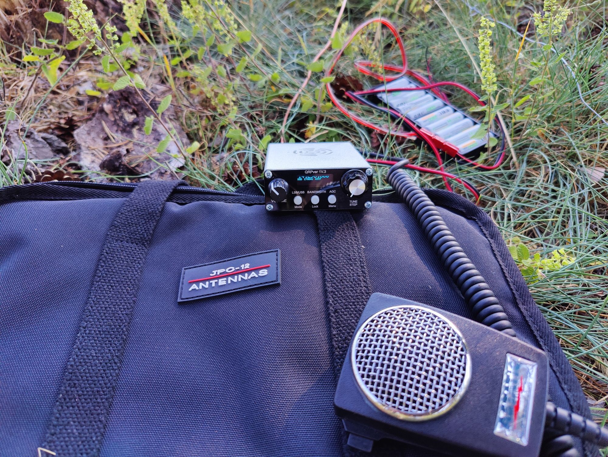 qrpver TX, 5w on 20m, with its microphone (about the same size of the transceiver)