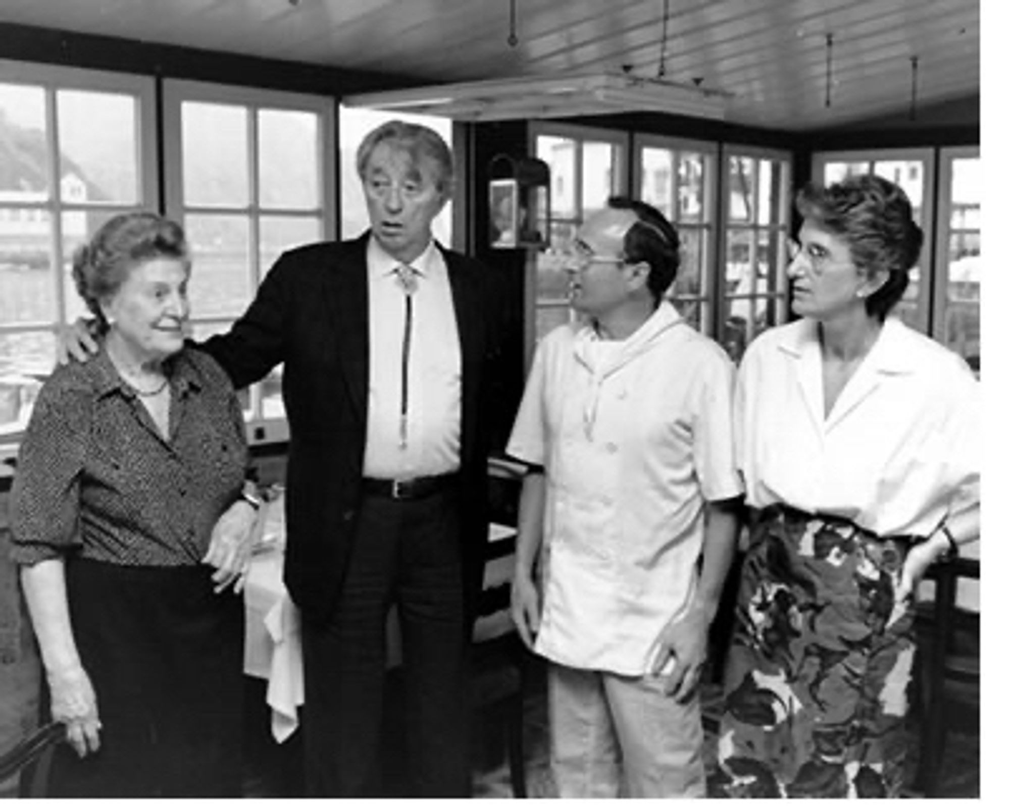 Robert Mitchum at Casa Càmara restaurant. He is standing with the staff and wearing one of those bootlace ties and now I want one.