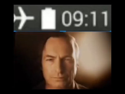 face of saul goodman looking into the camera dramatically below a screenshot of a phone taskbar in airplane mode at 9:11