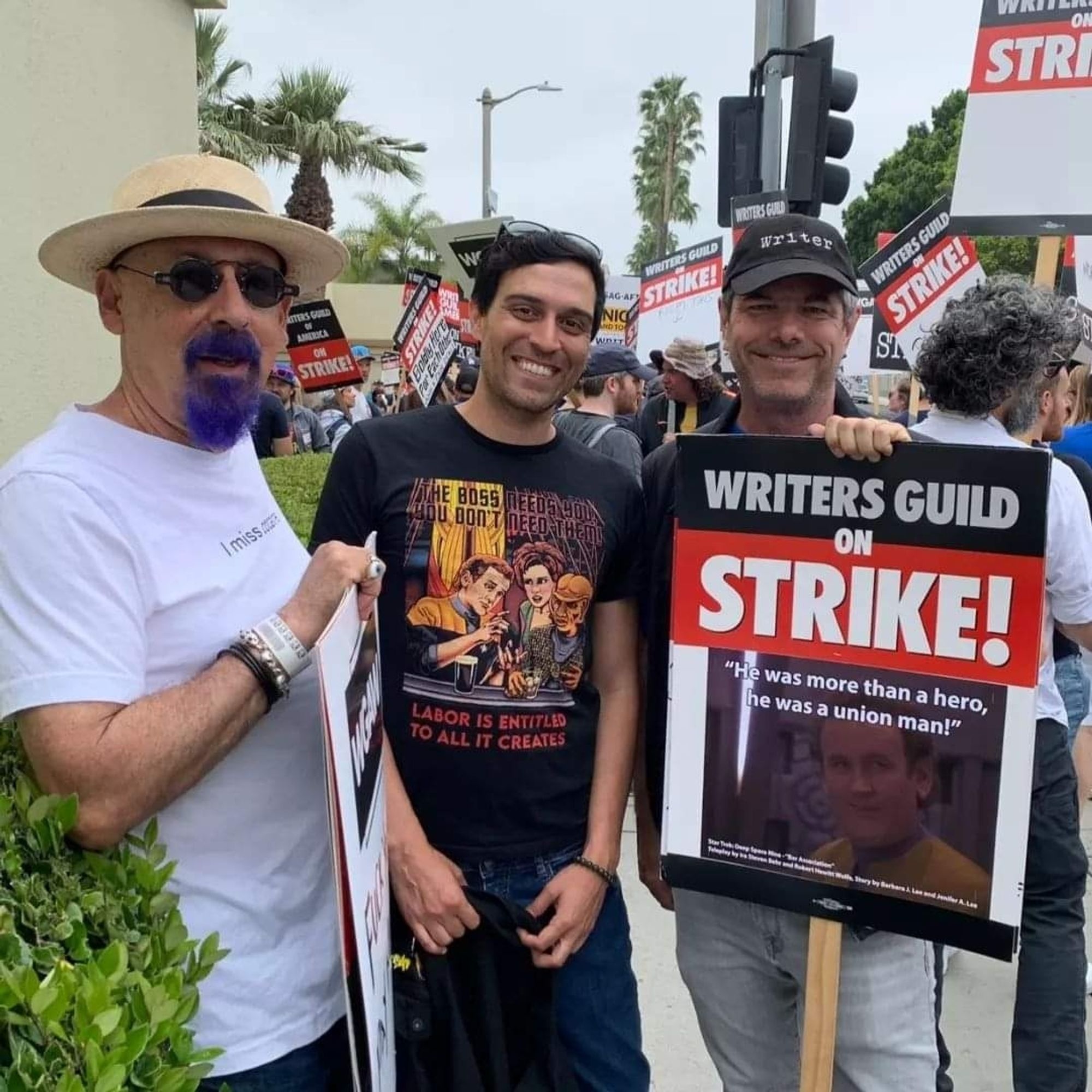 Carlos Cisco on the WGA picket line with Ira Steven Behr and Robert Hewitt Wolfe. Carlos has a pro-union DS9 T-shirt based on the episode "Bar Association," for which Ira and Robert wrote the teleplay. 