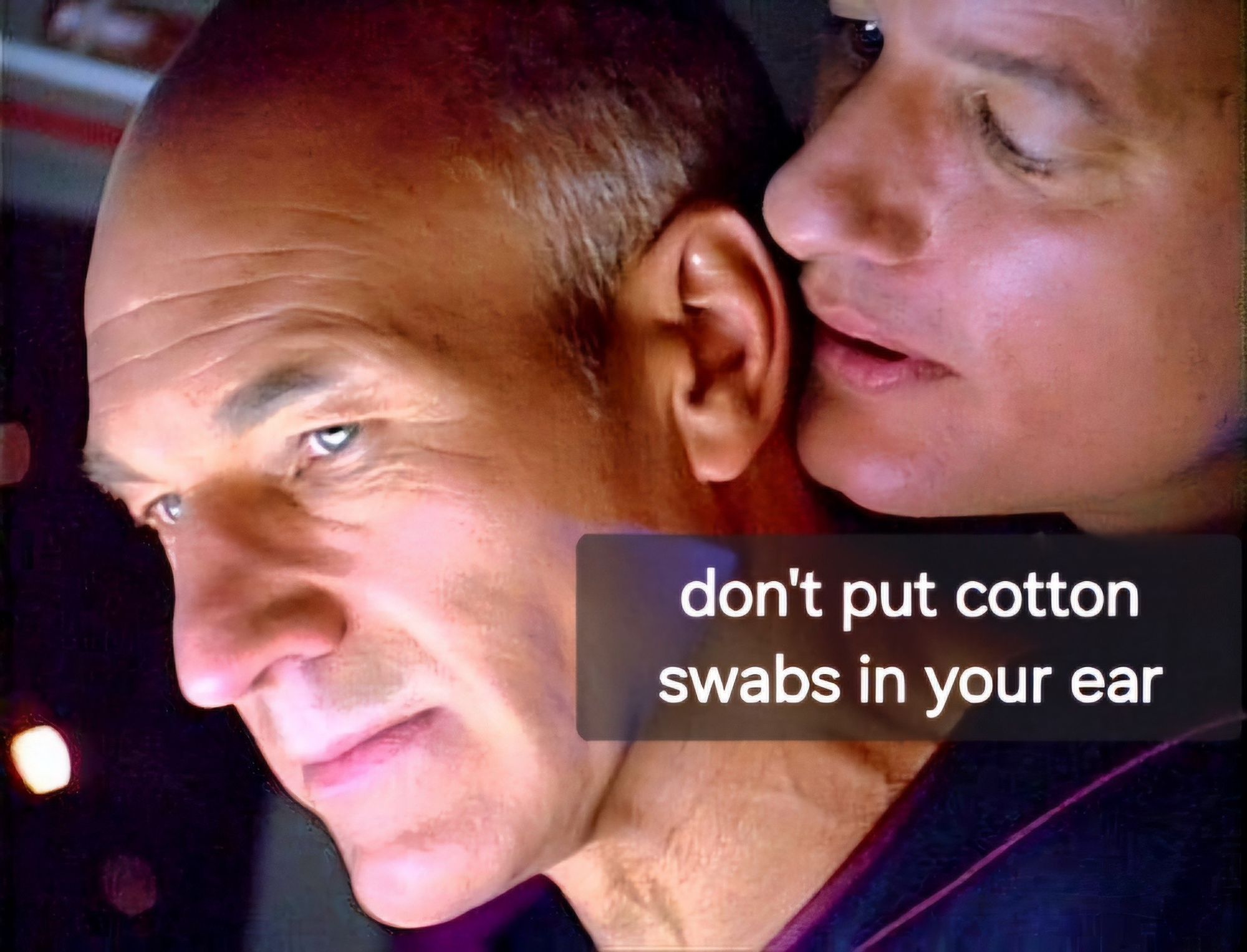 Q whispering into Picard's ear, "don't put cotton swabs in your ear"