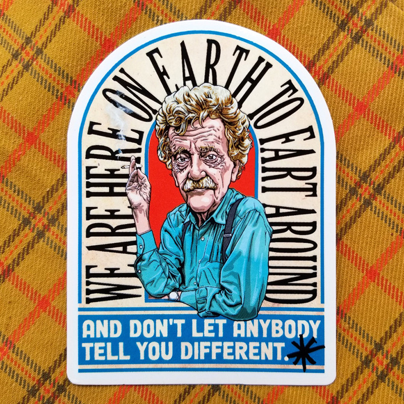 A vinyl sticker based on the original cover art for Slaughterhouse-Five. In the center, a drawing of Kurt Vonnegut smoking a cigarette, surrounded by the text, "We are here on earth to fart around, and don't let anybody tell you different." The sticker is shown on a yellow plaid background.