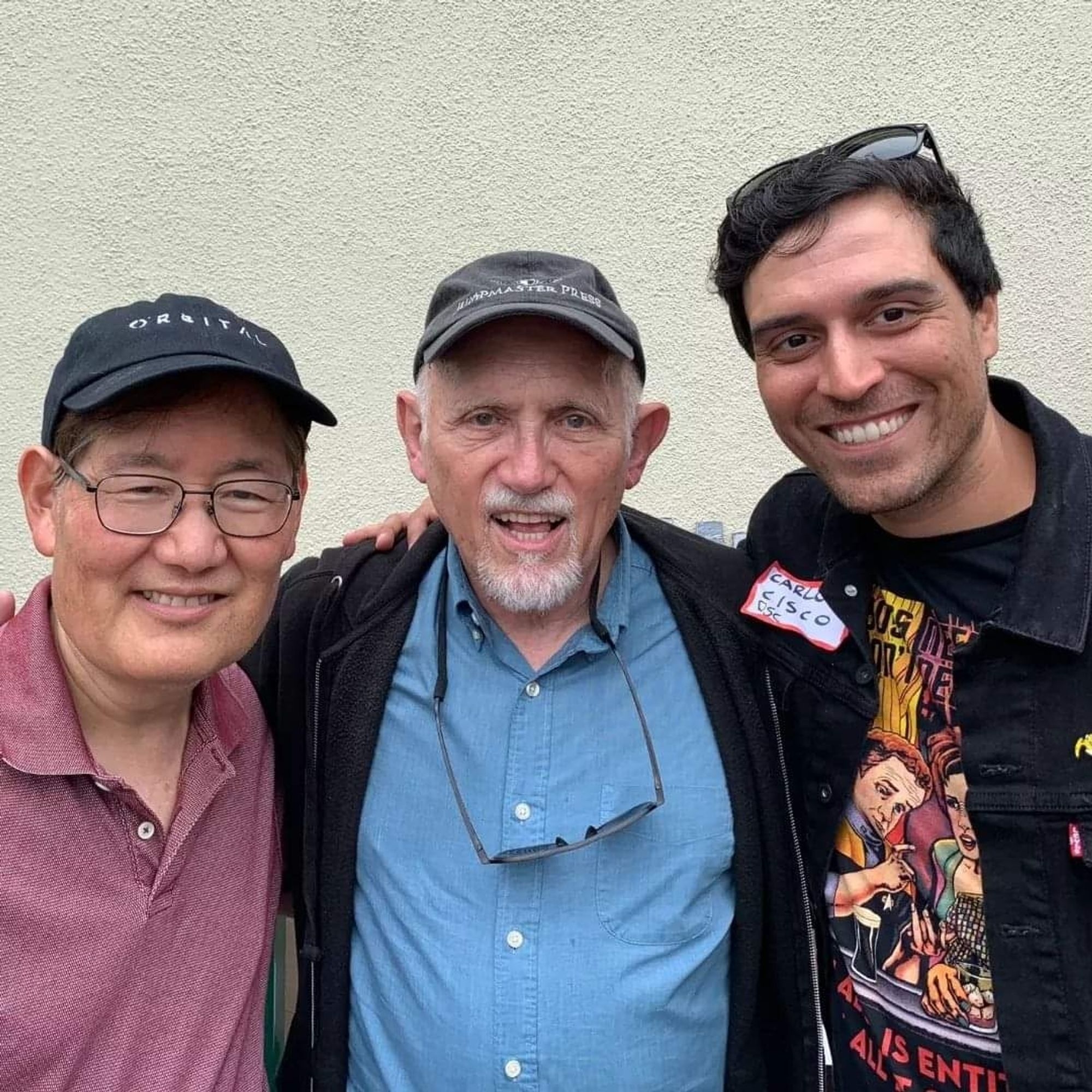 Michael Okuda and Armin Shimerman with Carlos Cisco on the WGA picket line.