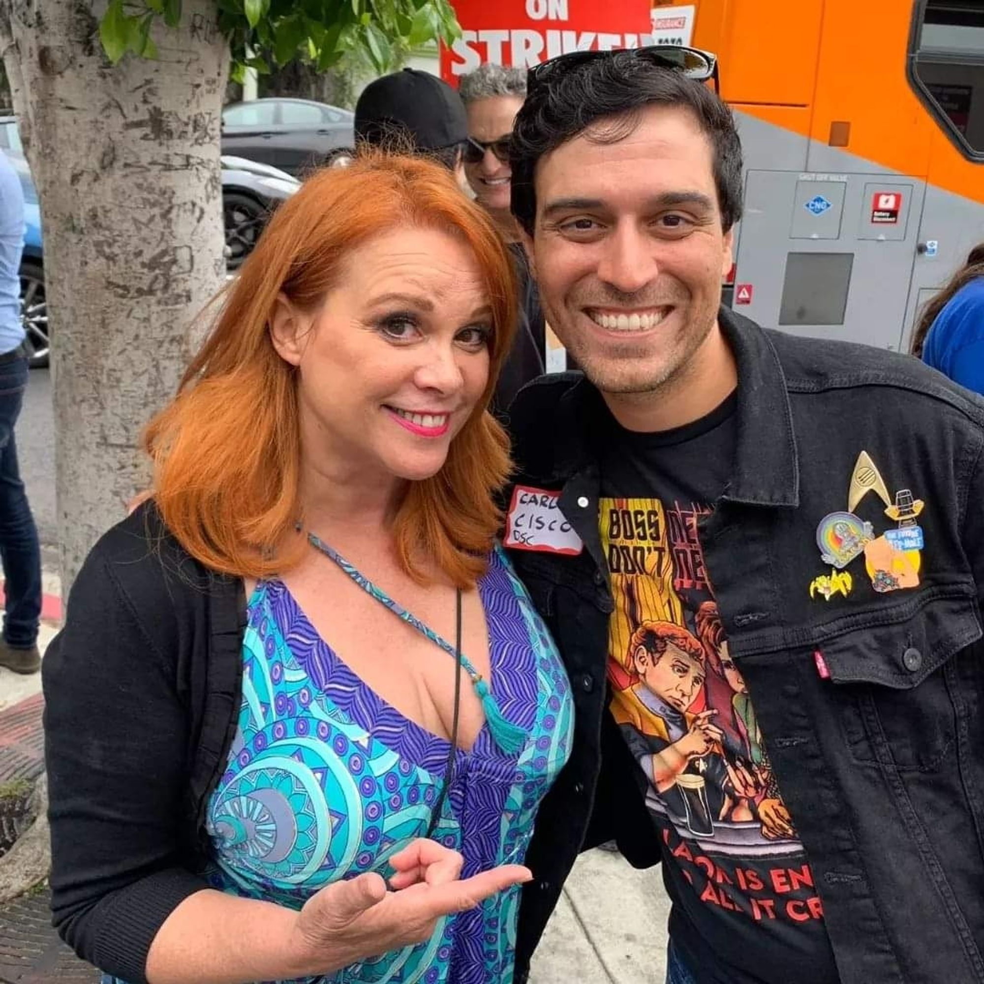 Chase Masterson with Carlos Cisco on the WGA picket line. Carlos's t-shirt features a picture of Chase's DS9 character Leeta with O'Brien and Rom.