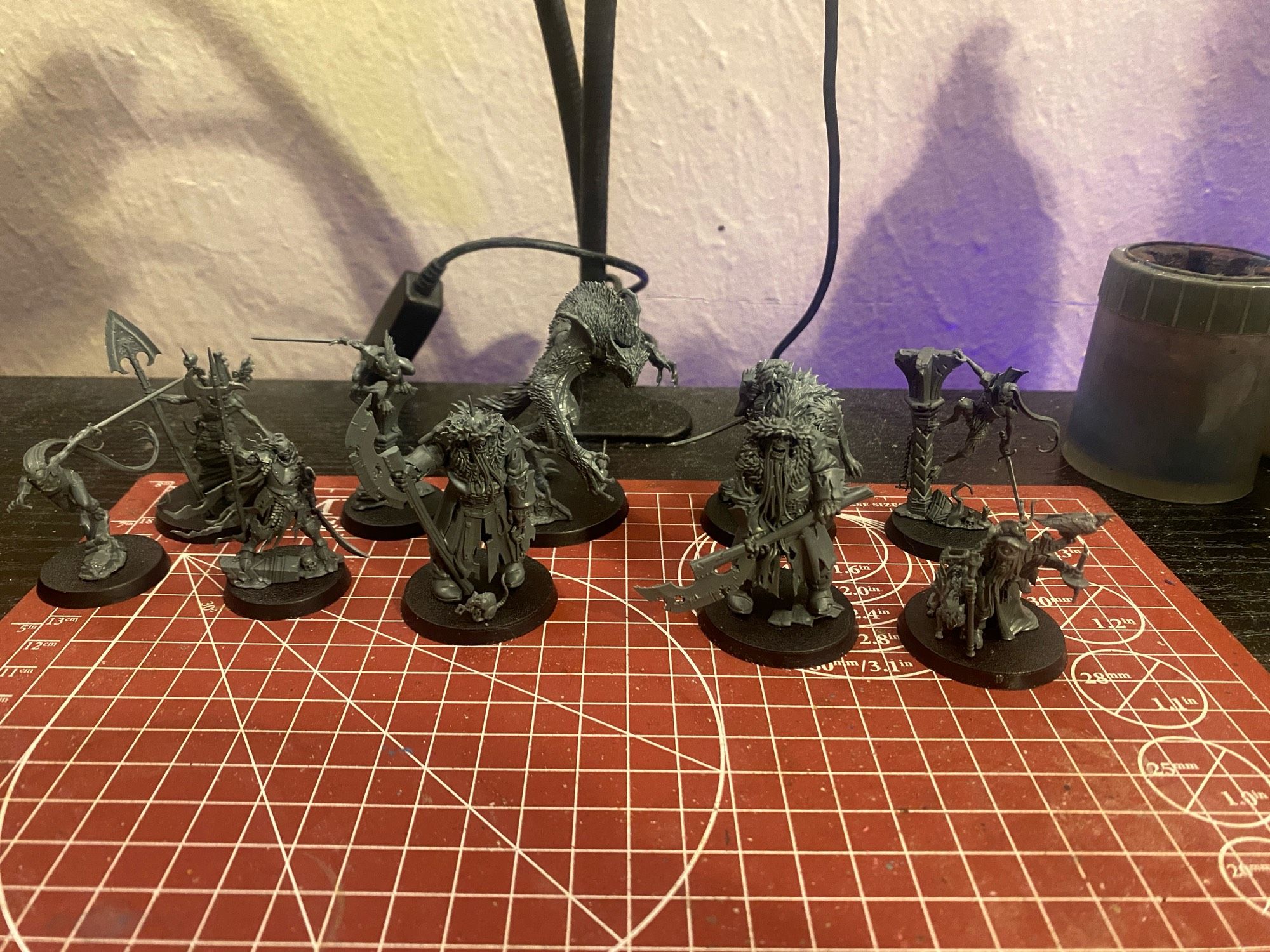 several assembled plastic miniatures from Warhammer's Cursed City boardgame