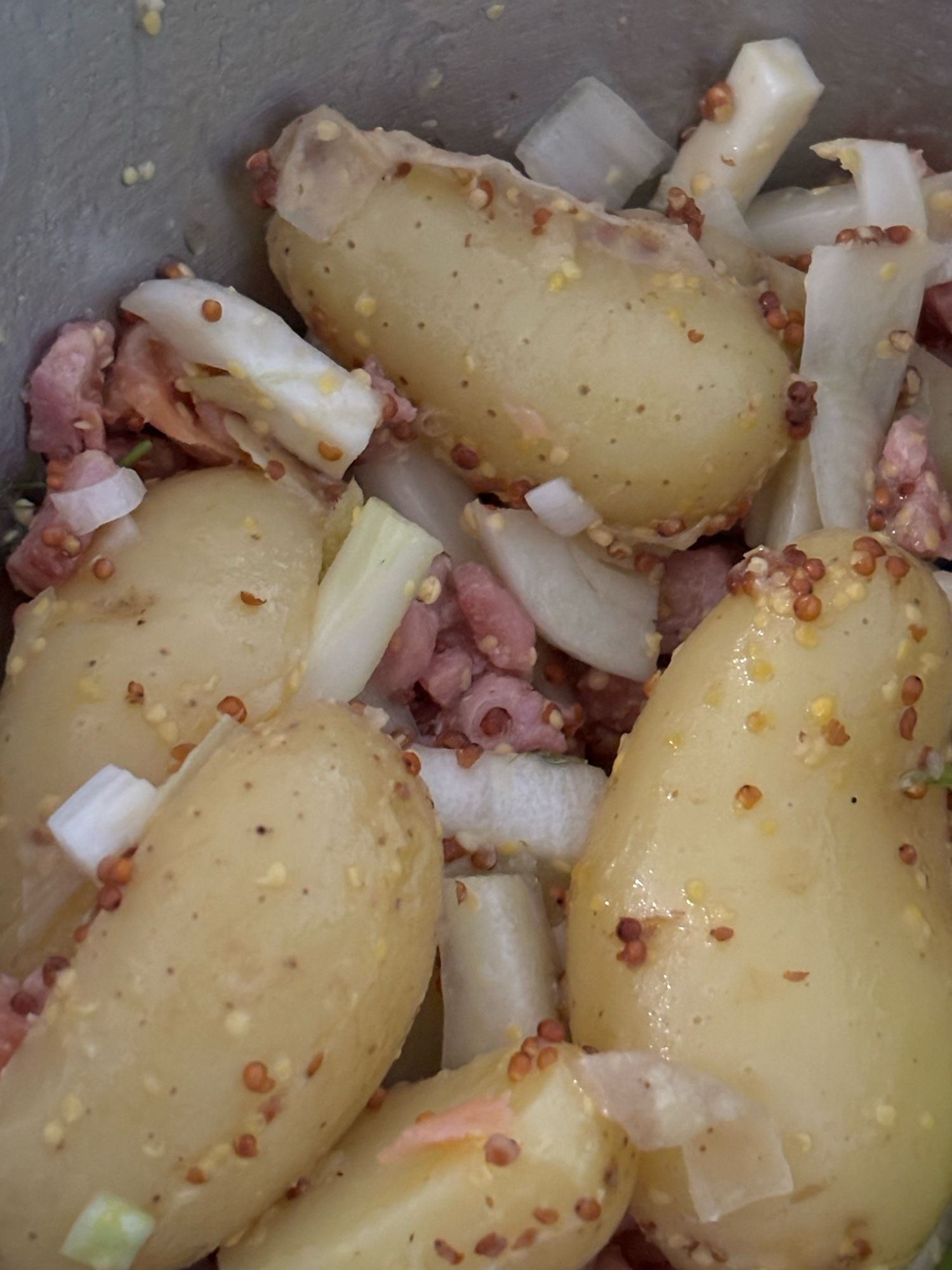 A picture of potatoes and lardons plus mustard