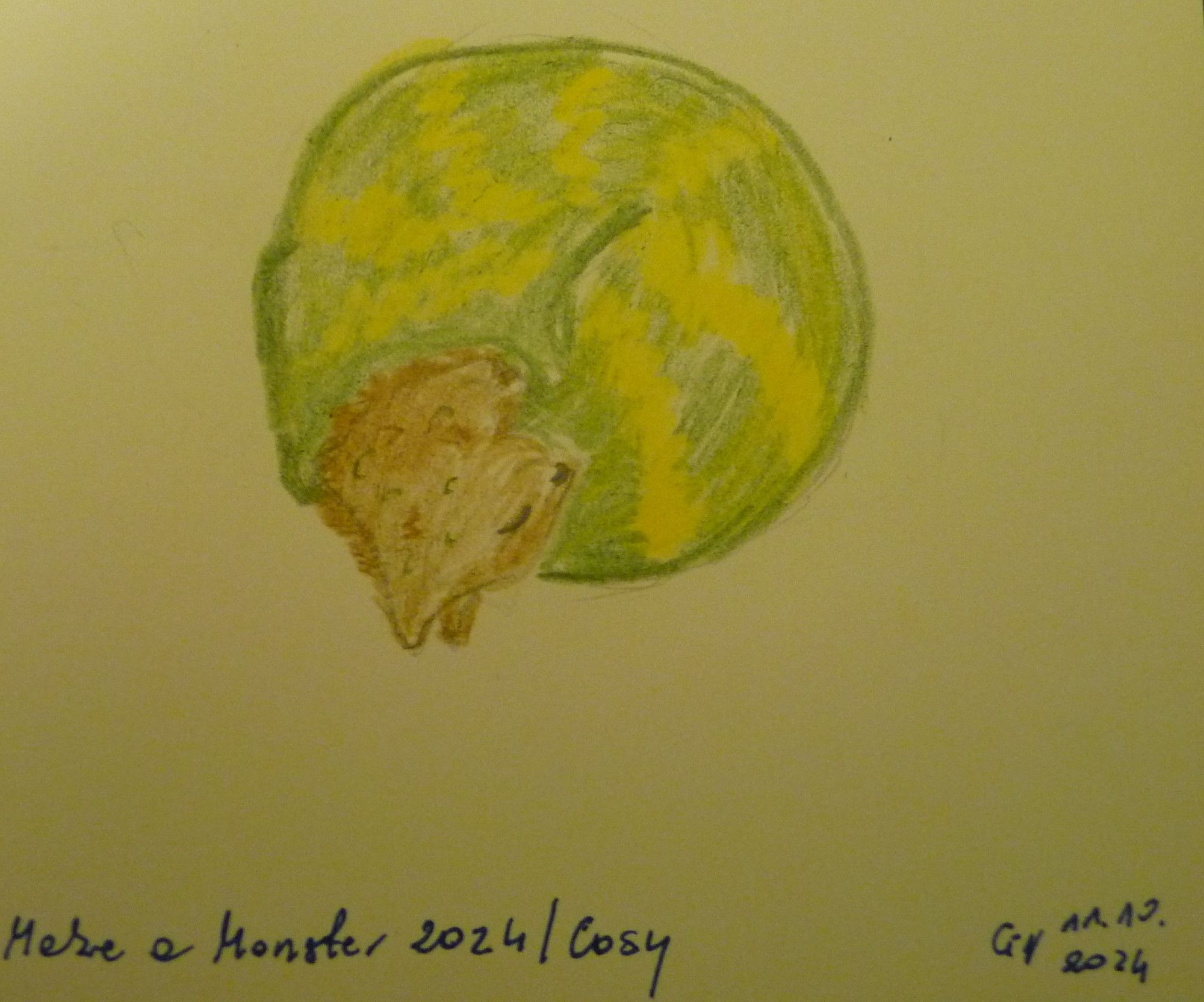 A drawing of a cat-dragon monster in a cosy blanket purrito rolled up like a shrimp. The cat is tabby and the blanket is green with ruff yellow stripes in this pose making it looking a bit like a snail's shell pattern. Under the drawing there's writing "Make a Monster 2024 / Cosy" and a signature "GN 11.10.2024".