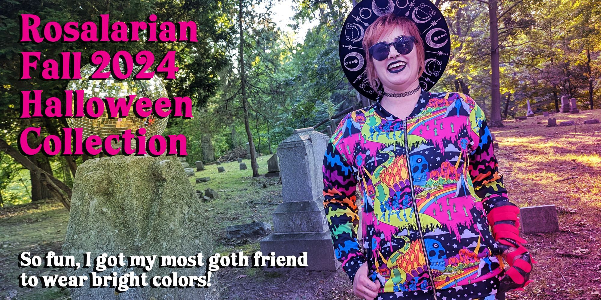 A photo showing a goth person smiling in a graveyard while wearing a bright and colorful yet spooky jacket. Overlaid on top are the words "Rosalarian Fall 2024 Halloween Collection" and "So fun, I got my most goth friend to wear bright colors!"