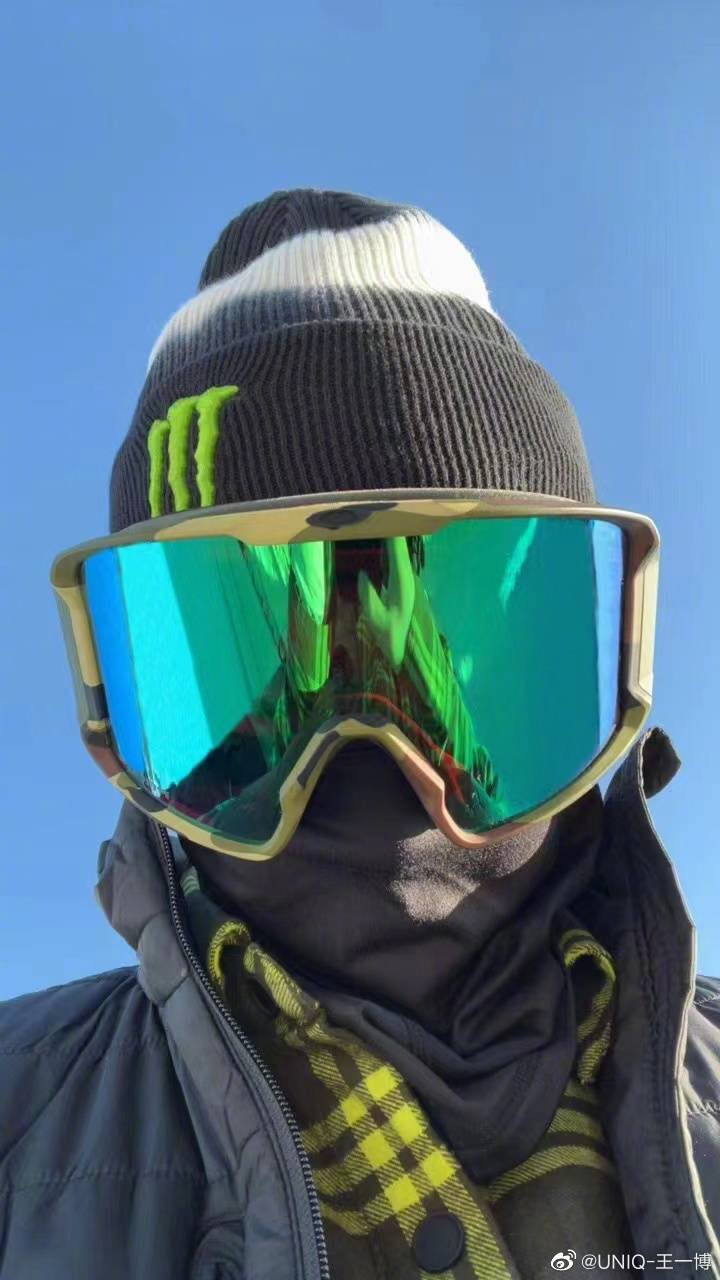 #WYB in a jacket, beanie, balaclava and a big metallic, reflective green ski mask : a selfie.