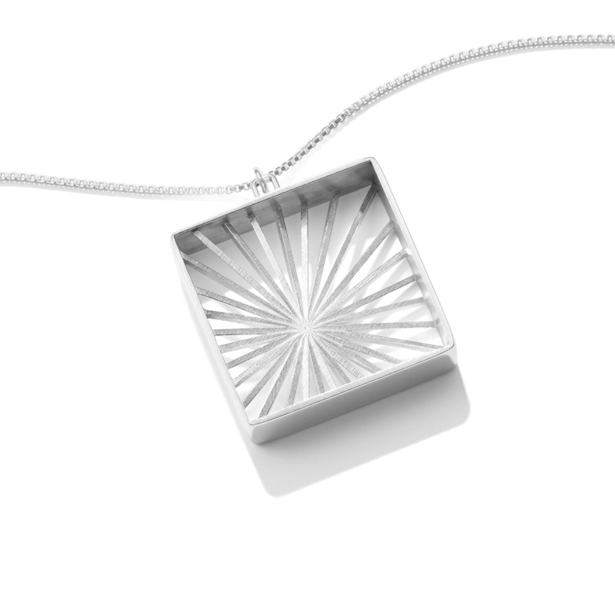 A photo of our Sunburst Pendant necklace.