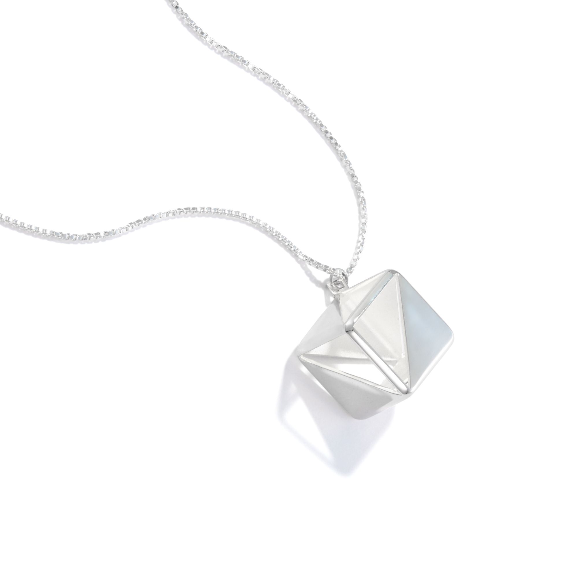 Illusion Square necklace. It's a cube with polished surfaces and missing surfaces that creates a somewhat difficult to process piece, as you're never quite sure if you're seeing metal, reflections, or emptiness.