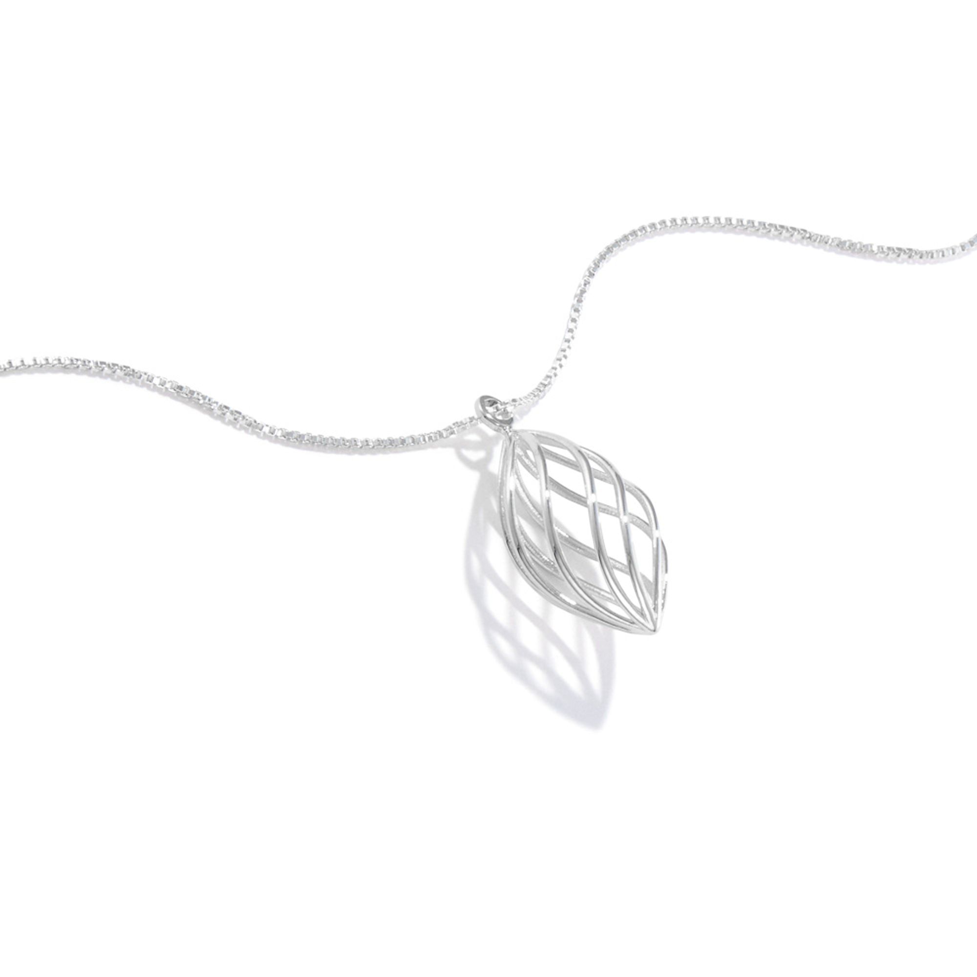 A photo of our Spiral Raindrop Necklace.