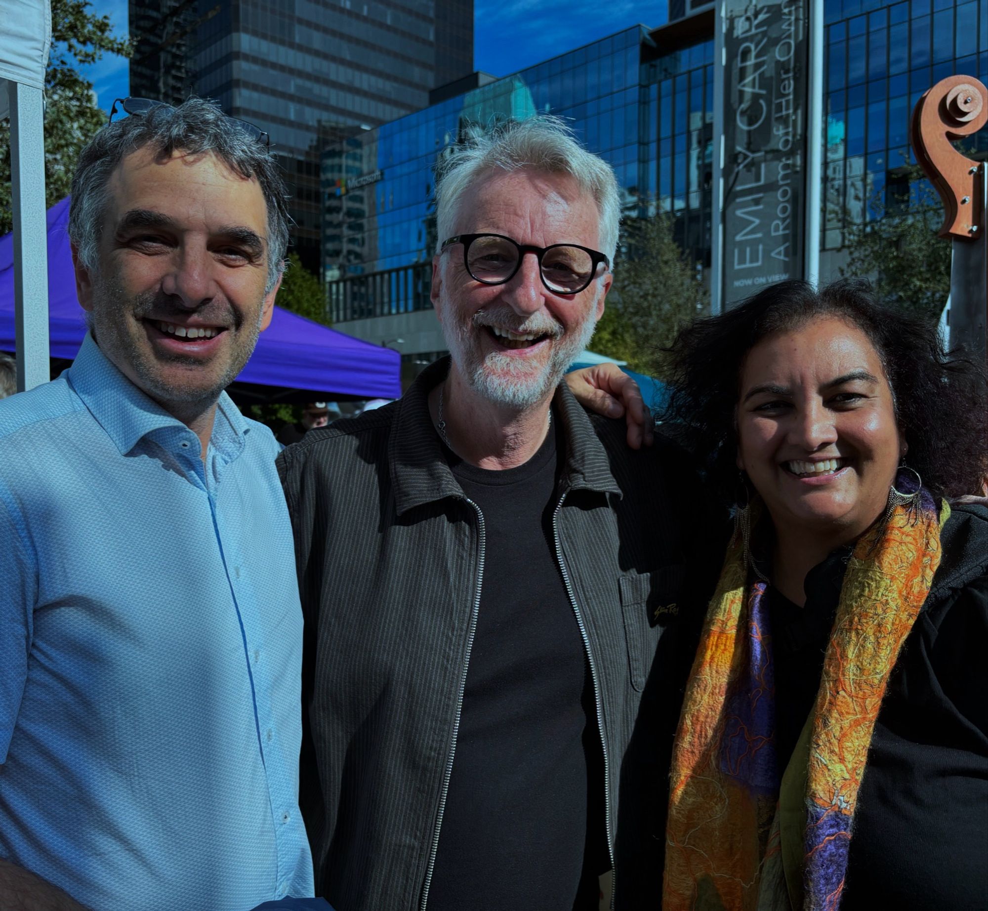 Patrick, Billy, and Ruby smile for a photo at the Vancouver Climate Strikes.