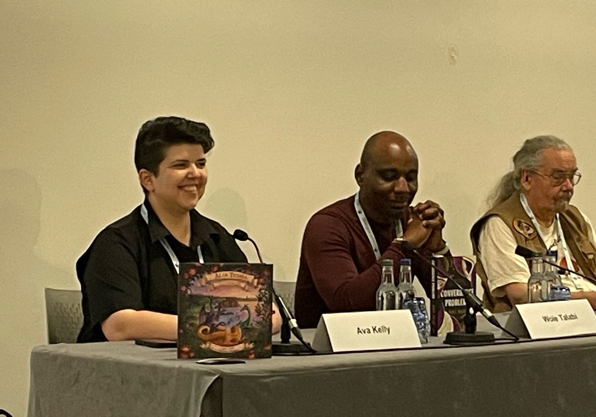 Ava Kelly next to Wole Talabi at panel table