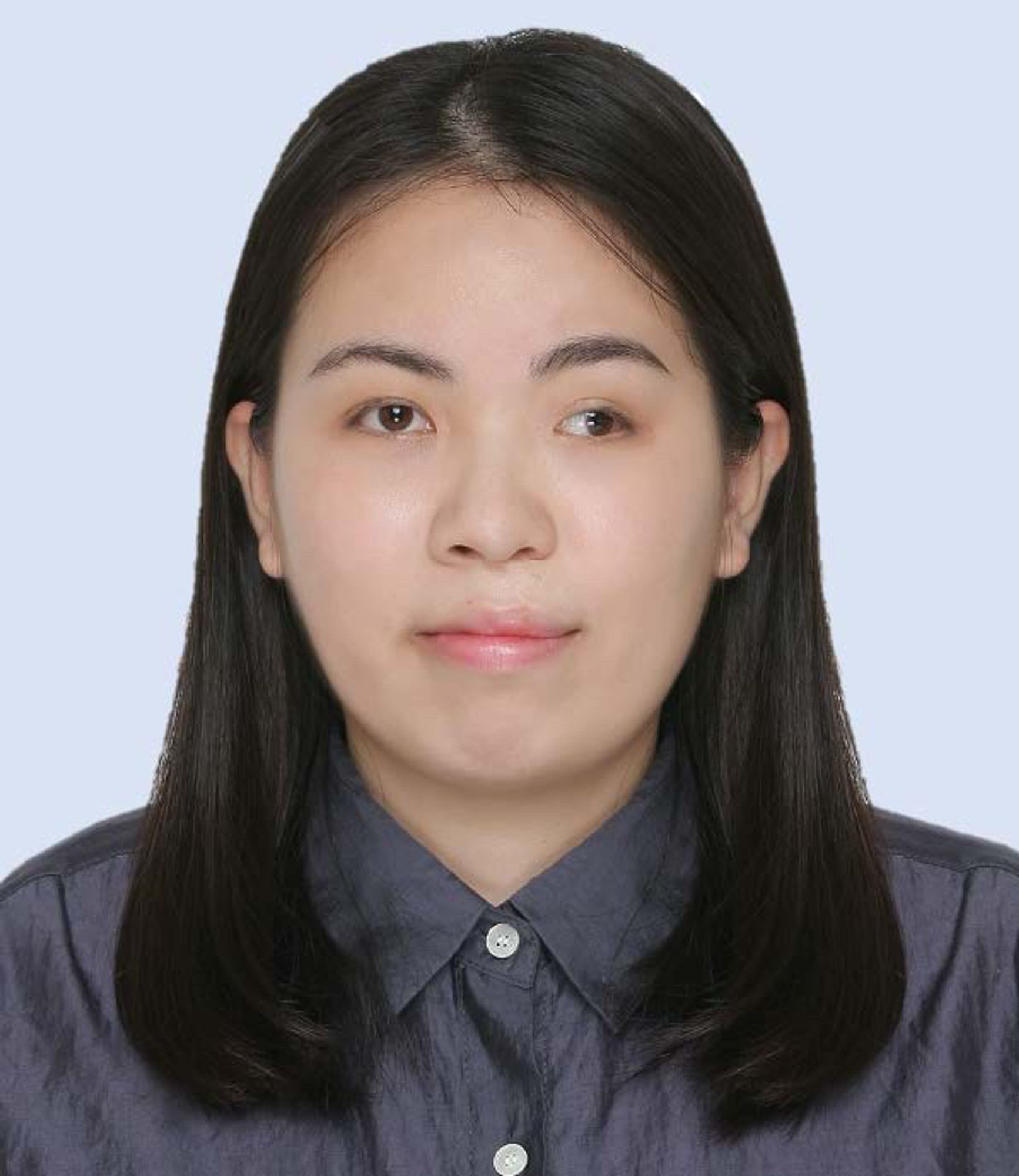 Headshot Jo-Ying Hung (woman with long black hair in dark gray blouse)