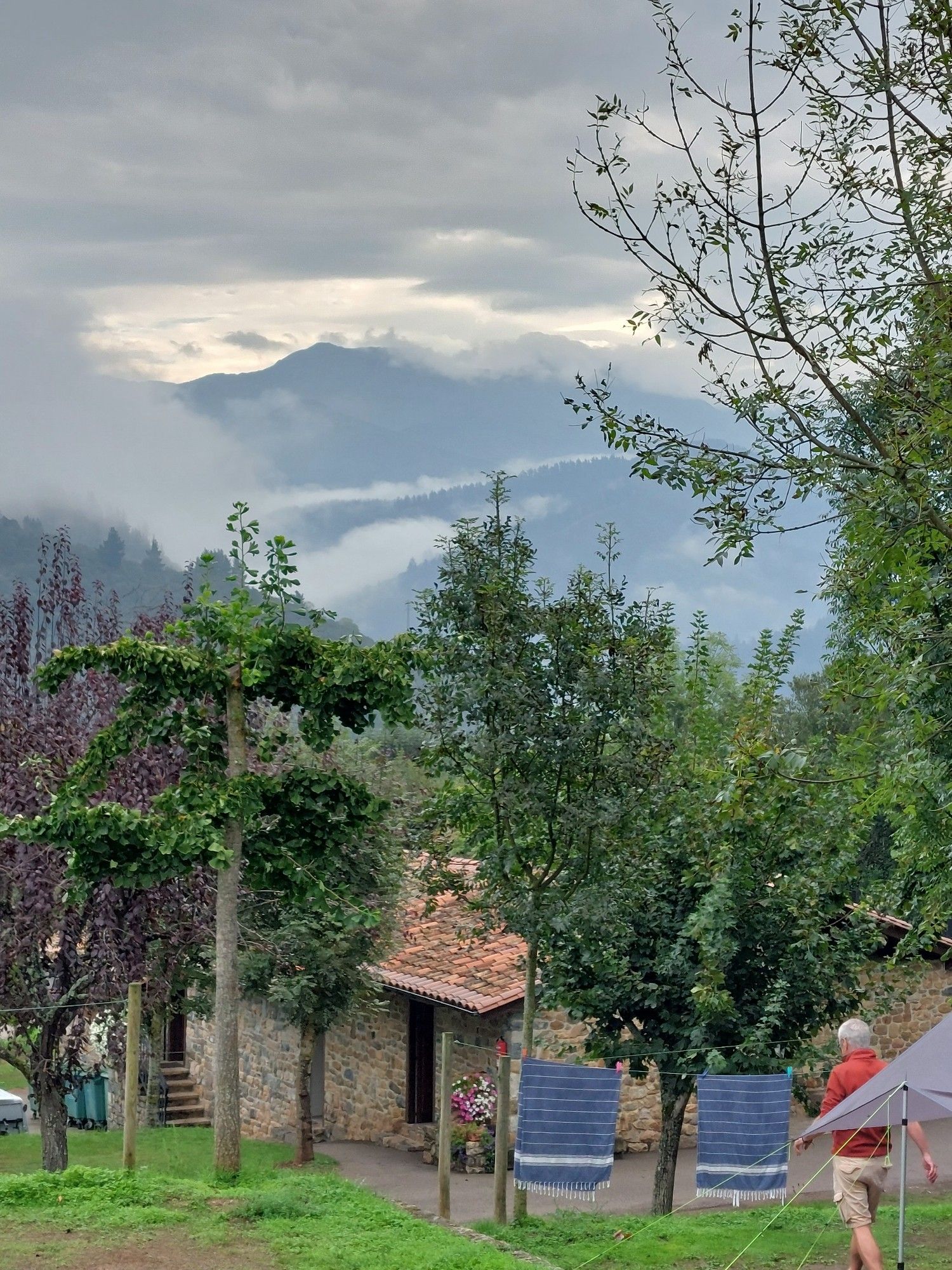 Mountain landscape with clouds in the valley bottoms