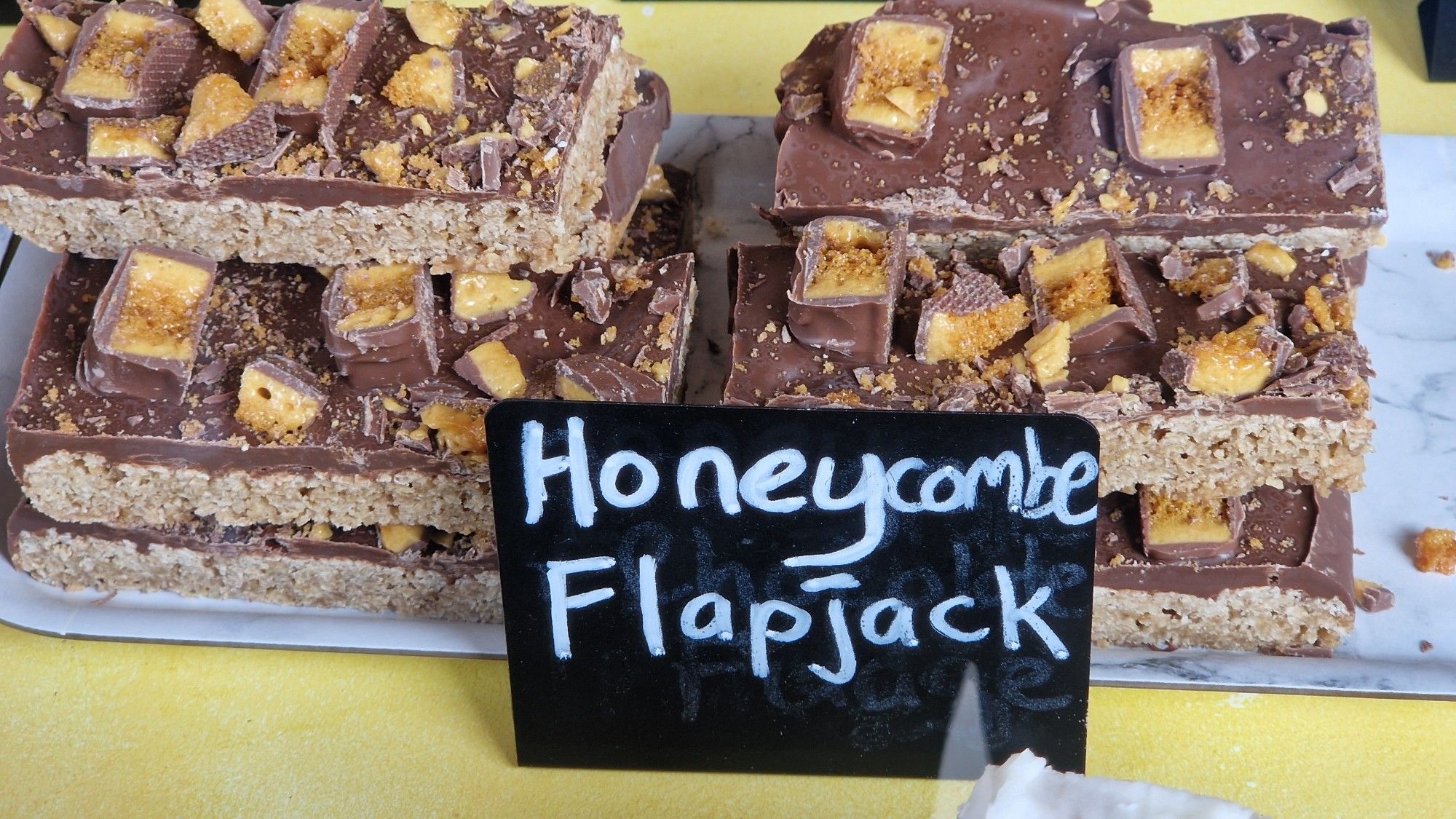 Some delicious treats with a label reading "honeycombe flapjack"