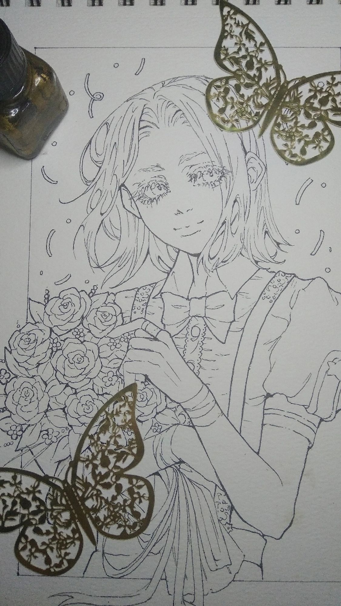 Work in process of a traditional sketch with lineart ,is a young boy holding a flower bouquet, in the page there is paper butterflies and a bottle of golden ink

#traditionalart  #venezuelanartist #labs107 #labs107ocs #duva #lineart #ink #inking #traditionaldrawing #animestyle #ocs #butterfly #flowers #photo #doll #sketchbook