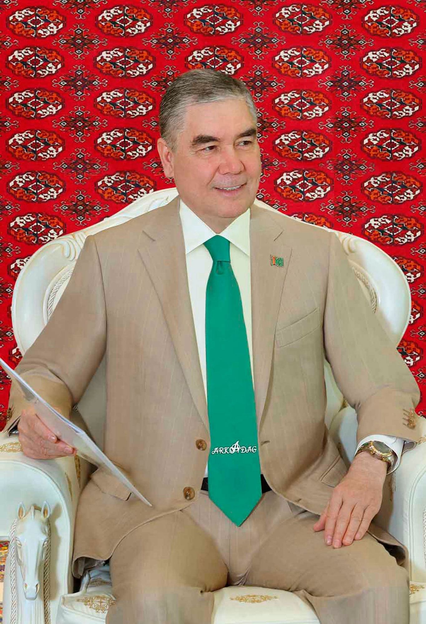 Former Turkmenistan President Gurbanguly Berdimuhamedov wearing a tan suit with very tight trousers. I am disturbed.