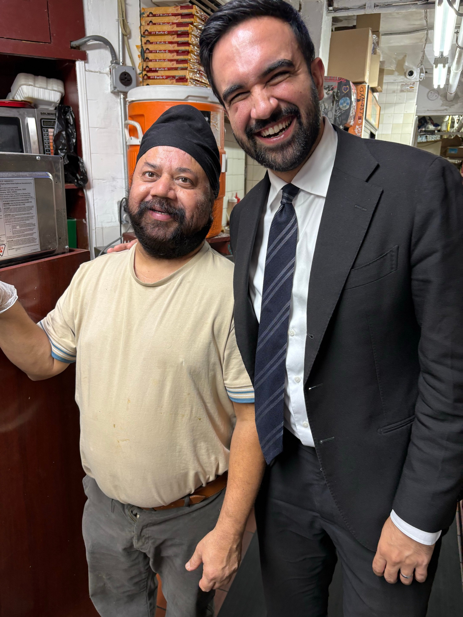 Zohran and the owner of Punjabi Deli.