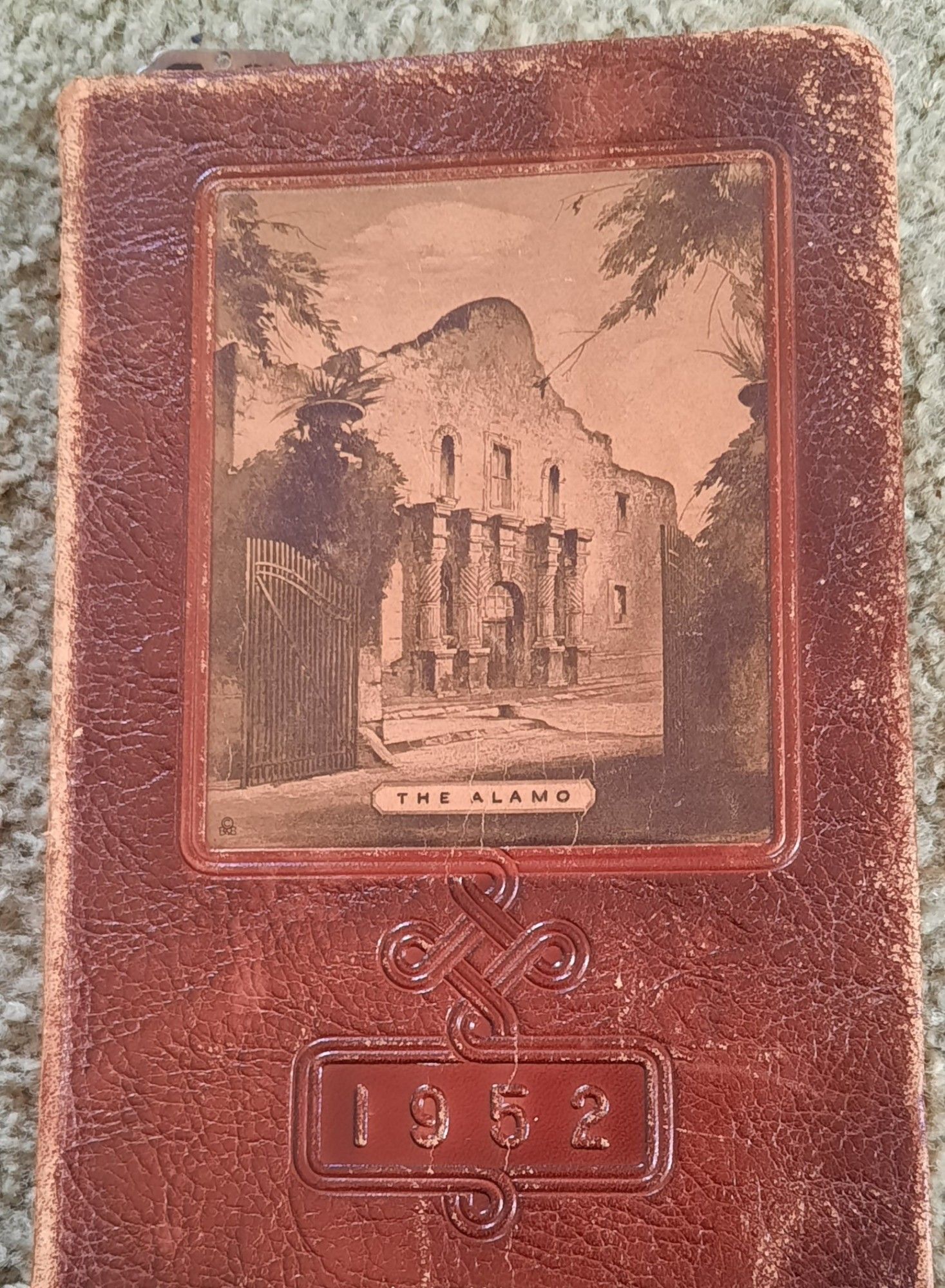 Leather book with a photo of the Alamo dated 1952.