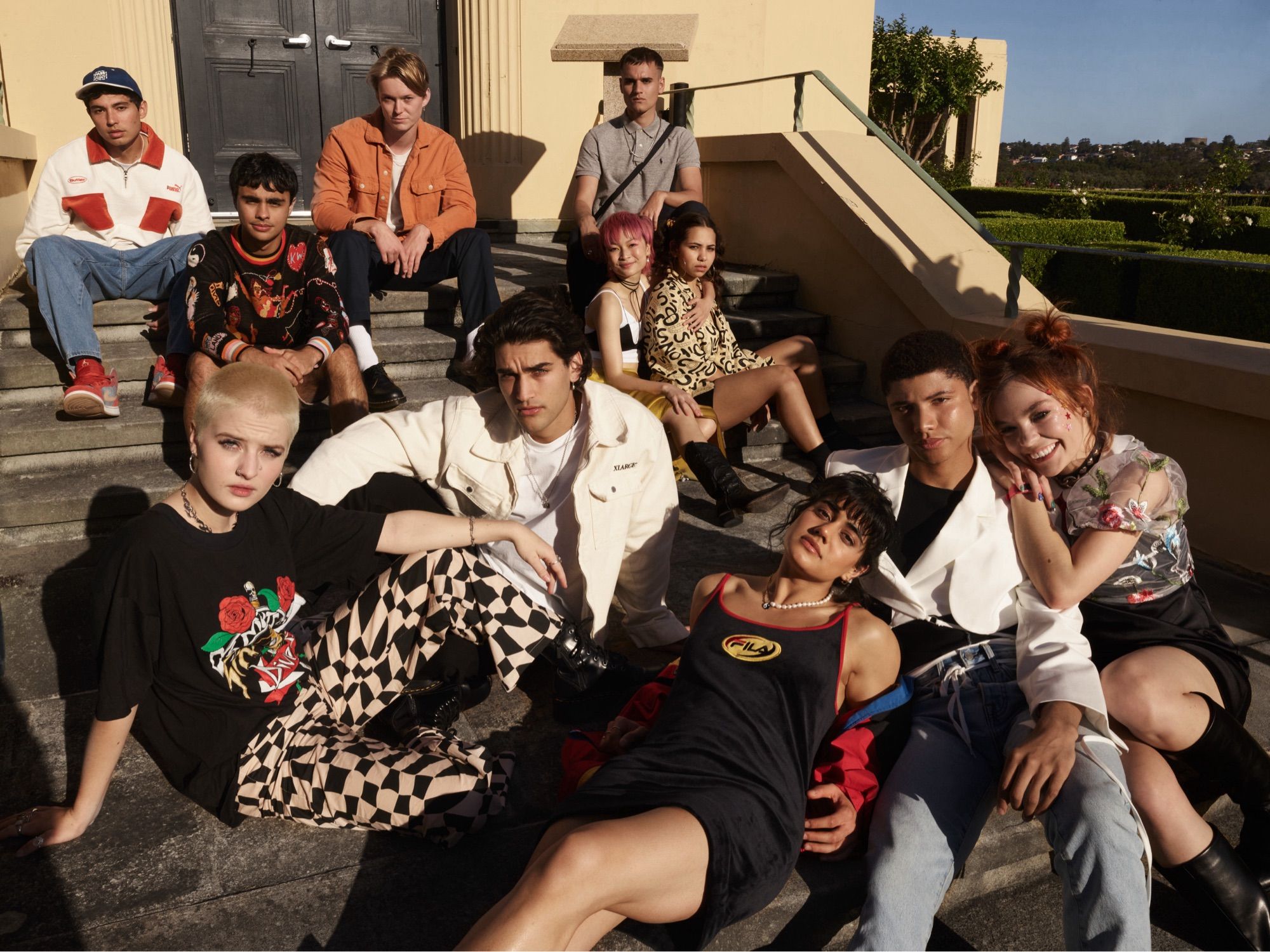 An inclusive range of actors pose in a promotional image for the cast of Heartbreak High, a Netflix reboot of an Australian show.