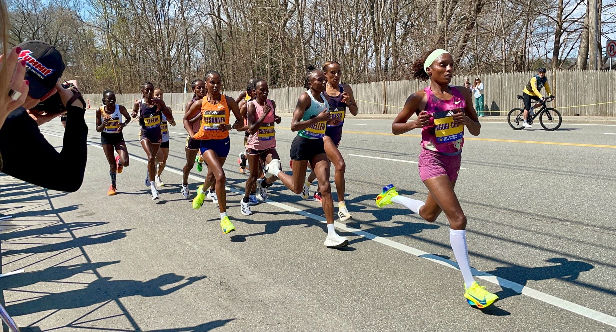 The lead women’s pack of about 10 runners for the Boston Marathon just before mile 17