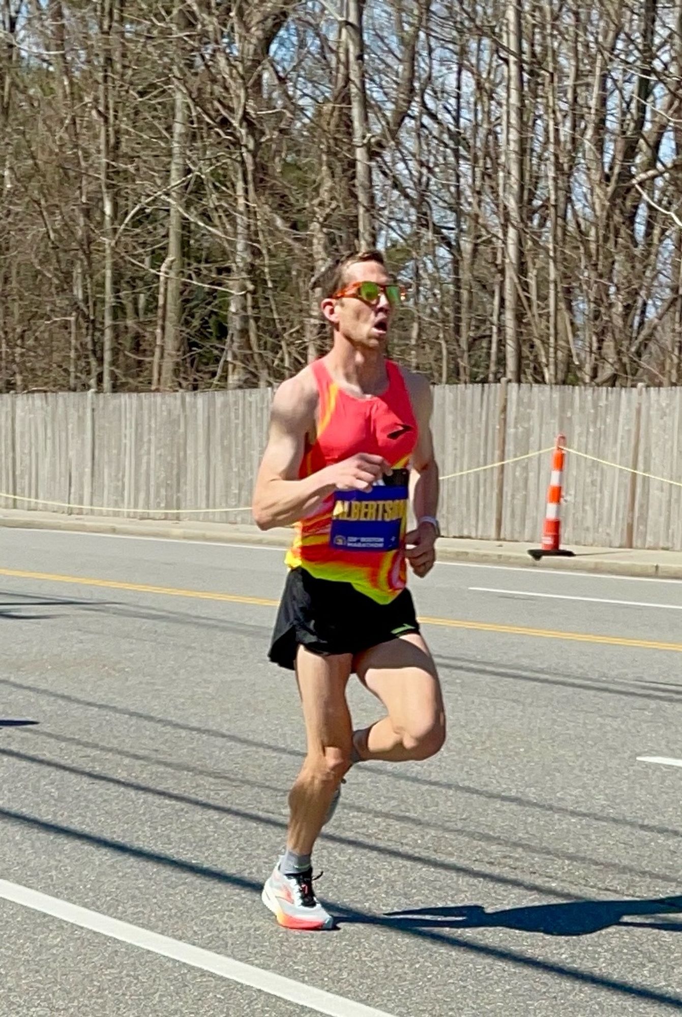 A photo of CJ Albertson running in the Boston Marathon just before mile 17