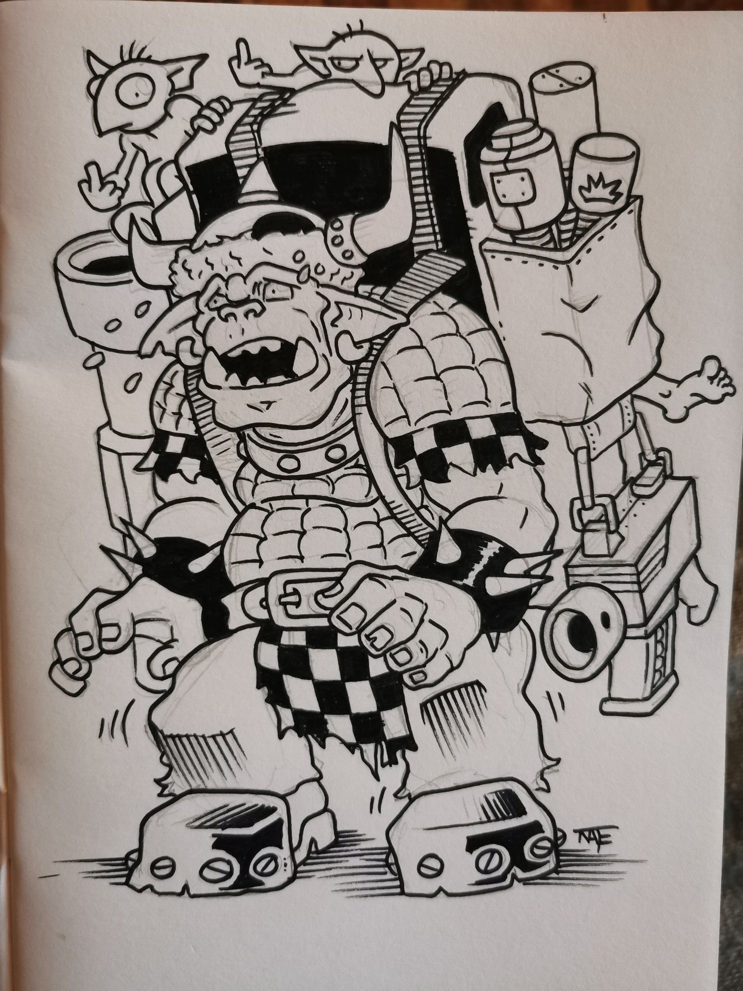 A Warhammer 40,000 2nd edition Ork struggles with a huge backpack.