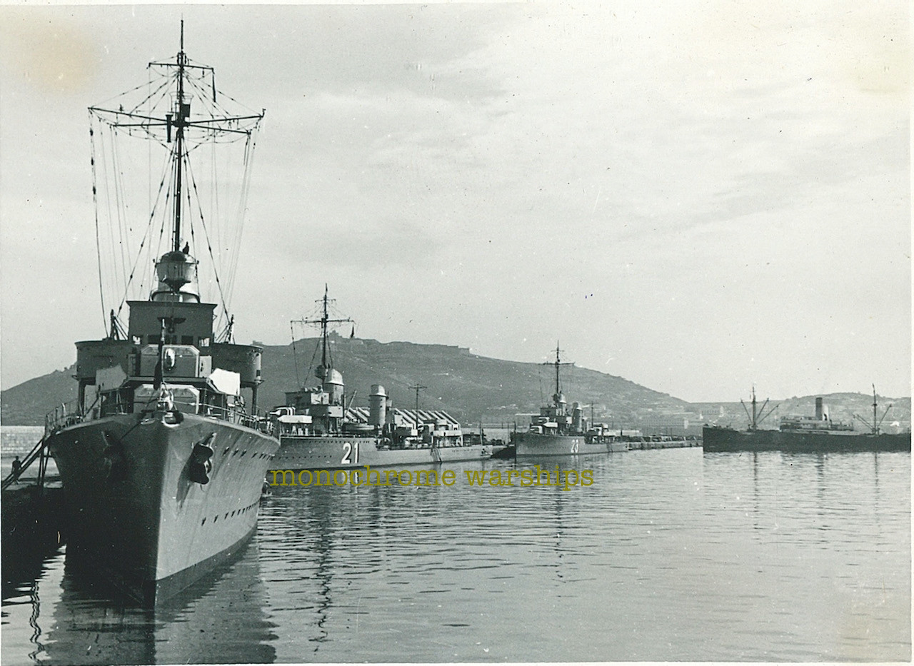 Kreigsmarine destroyers Paul Jakobi (21), Z7 Hermann Schoemann (23) & possibly Z6 Theodor Riedel alongside a quay. Background looks like it may be Ceuta, which the 2nd Destroyer Division visited in 1938.