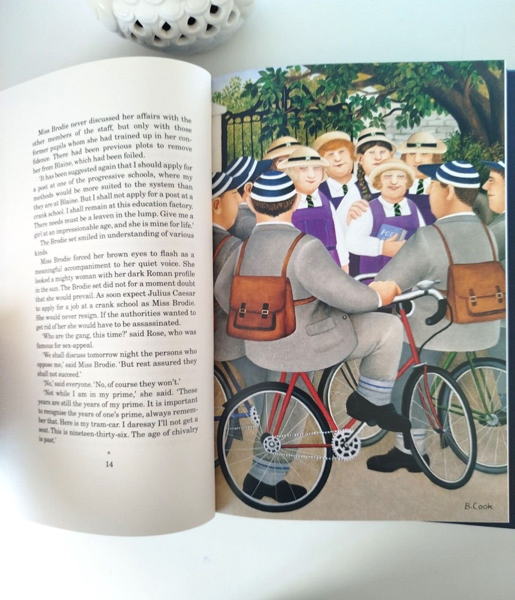 Illustration from the Folio edition of Miss Jean Brodie, by Beryl Cook, showing the girls and the boys with bikes in Cook's signature style, making everyone rotund, comical, and seaside postcardish.