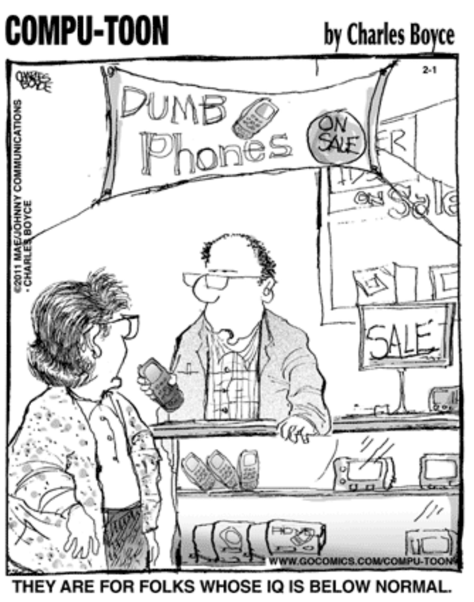 A screenshot of a "Compu-toon" single panel cartoon by Charles Boyce. There are two frumpy middle aged white people in a phone store, a balding guy with glasses looking bored addressing a customer turned towards him. There is a banner behind the employee saying "Dumb Phones On Sale." The caption is:

THEY ARE FOR FOLKS WHOSE IQ IS BELOW NORMAL.