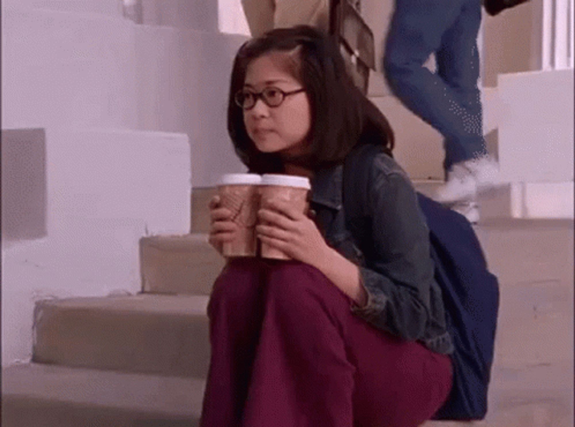 Lane Kim of Gilmore Girls sitting with two cups of coffee, waiting…