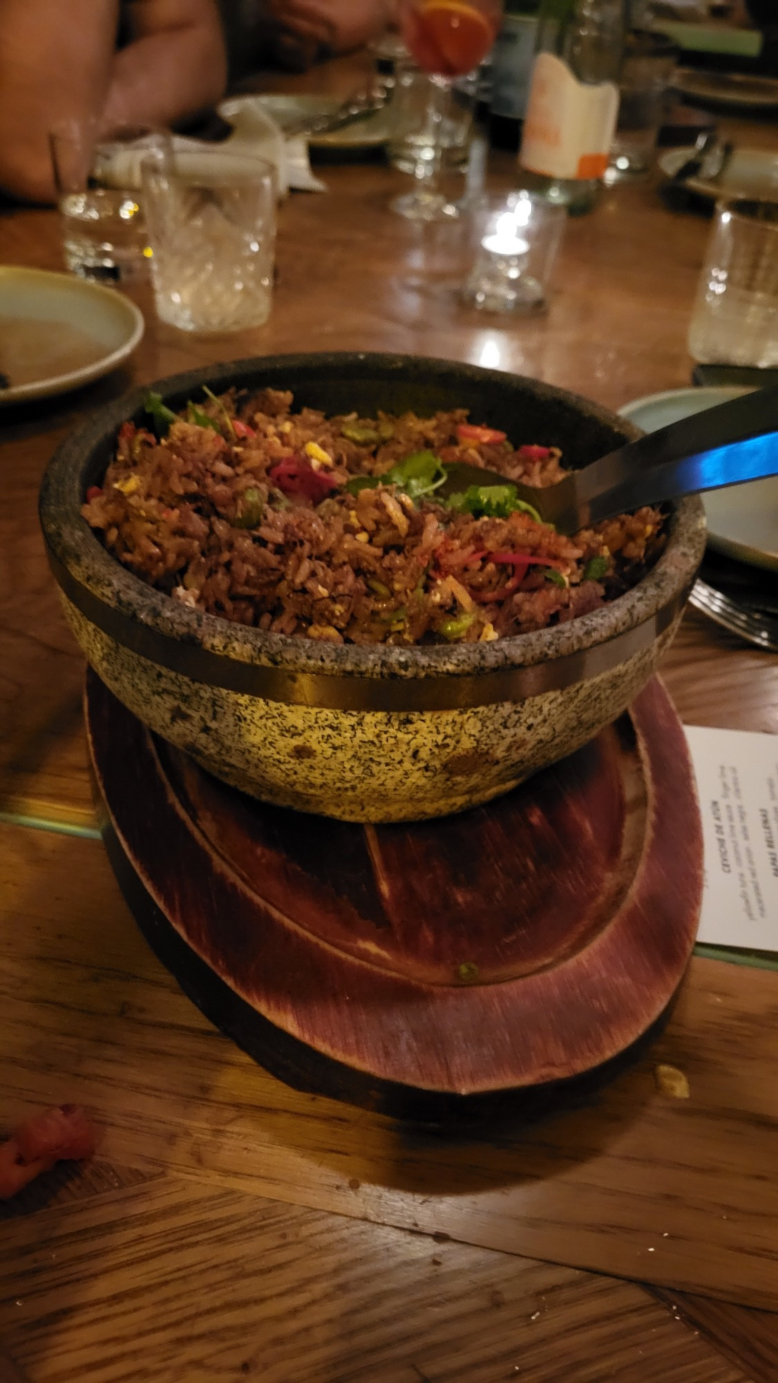 Stone bowl with flavorful rice in it