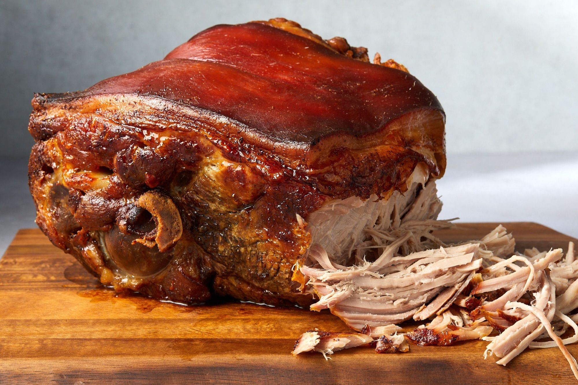 Photograph of pernil on a cutting board.