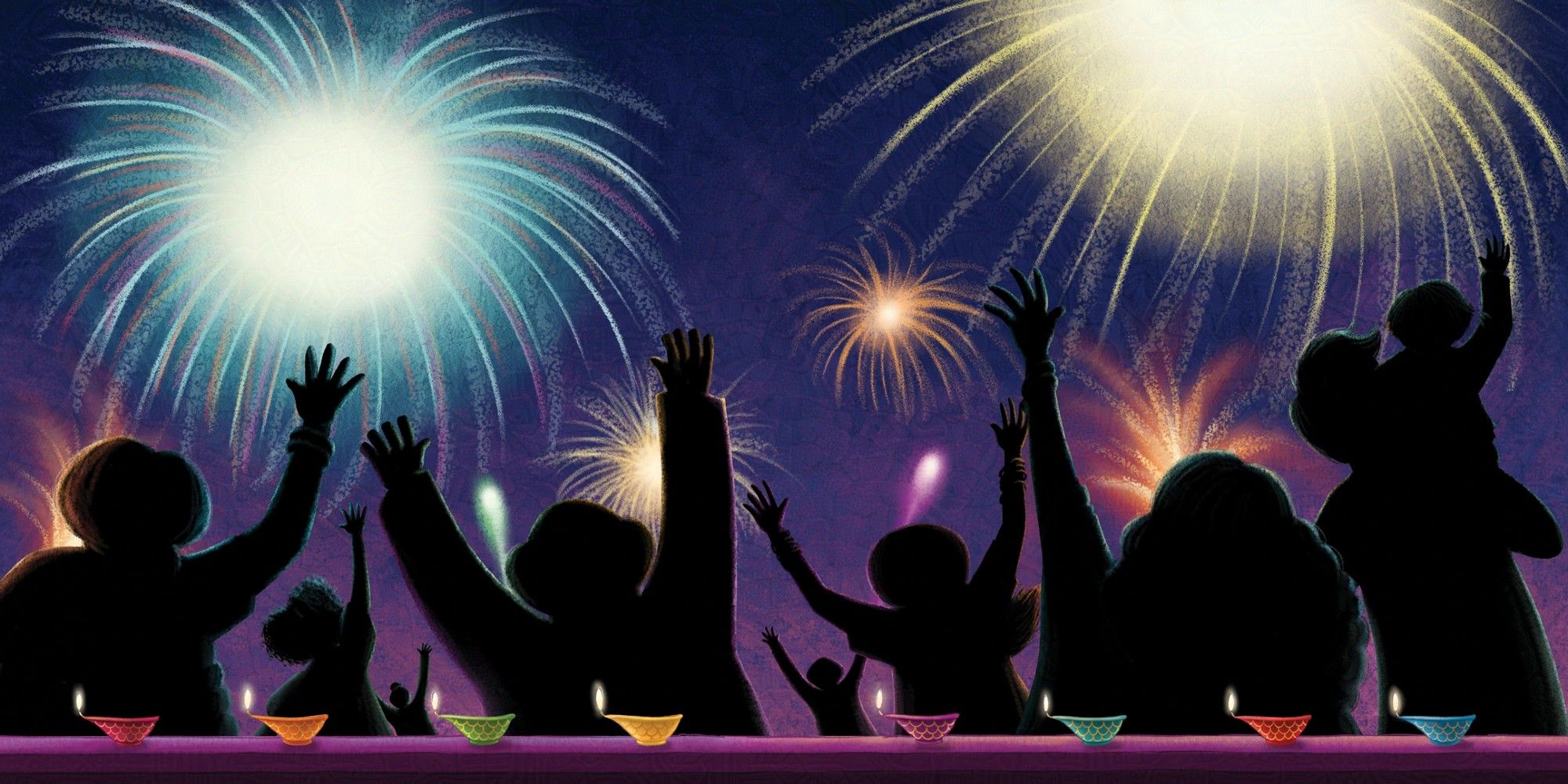 Silhouettes of people look up at the sky with their arms skyward as colourful fireworks burst above them in the night sky. In the foreground are a line of diya's shining brightly against the silhouettes