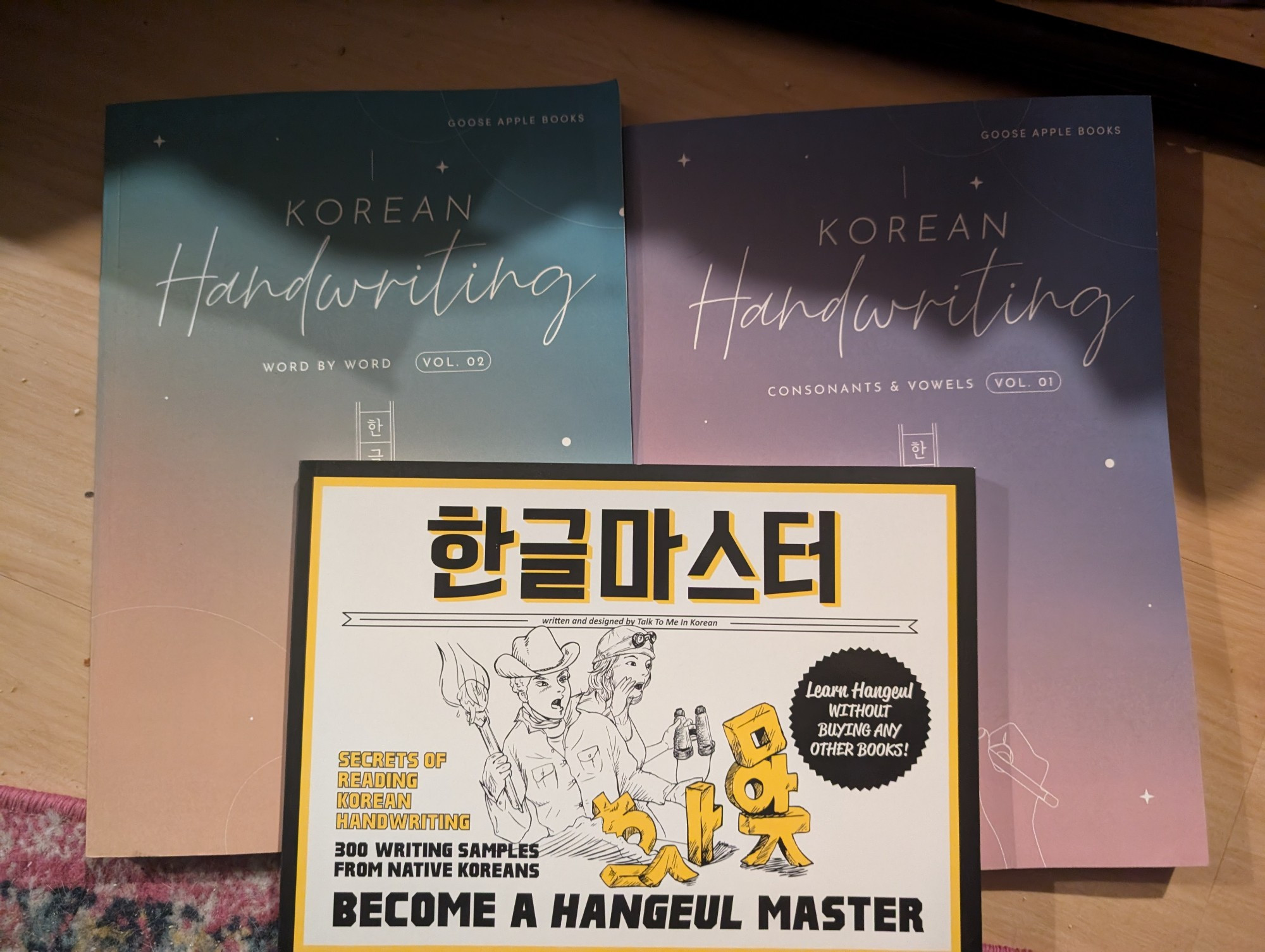 2 Korean handwriting workbooks and TTMIK Hangeul Master 