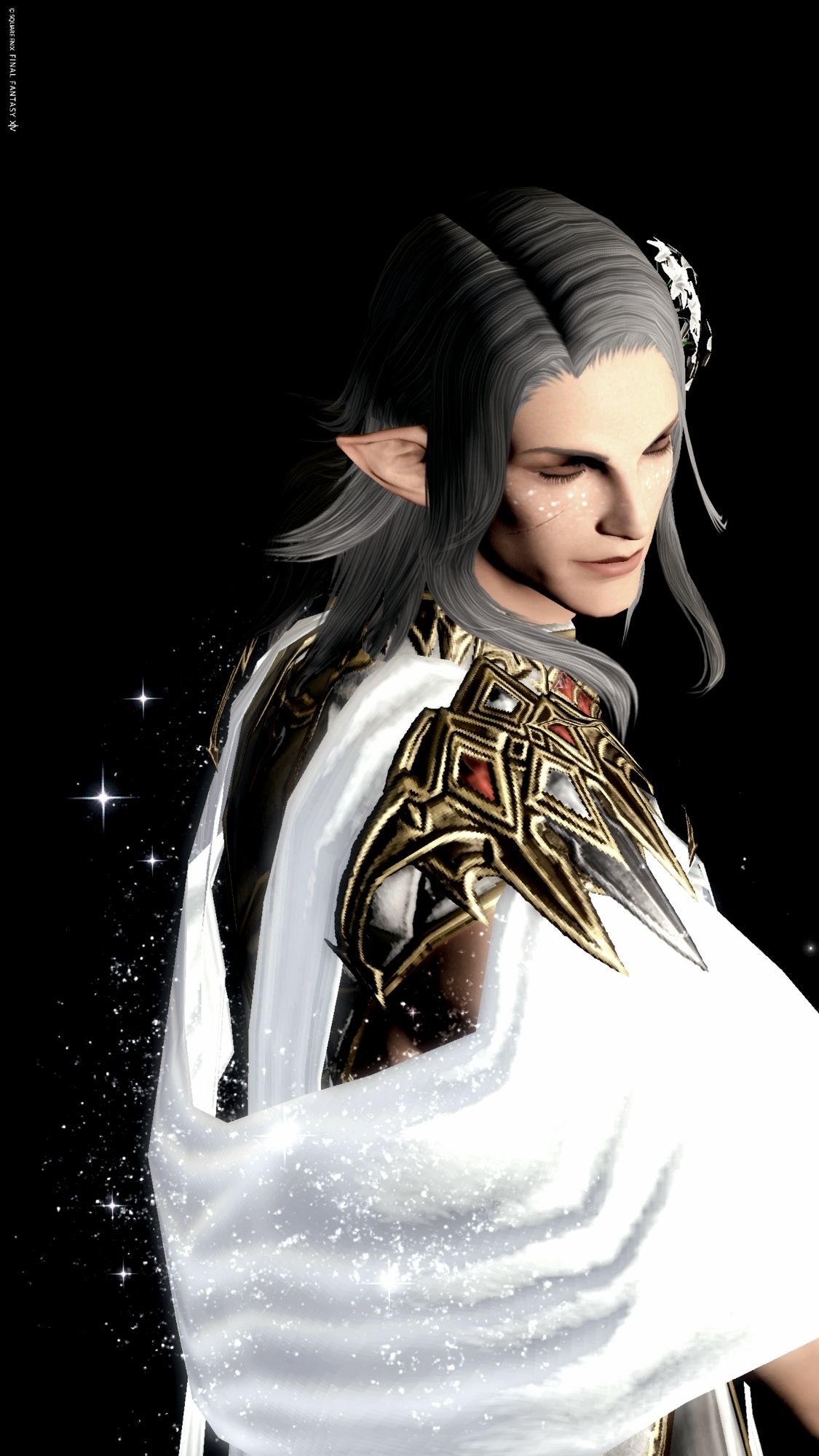 My elezen WoL Caius in front of black background, with his eyes closed and wearing a bright, sparkling white and golden robe