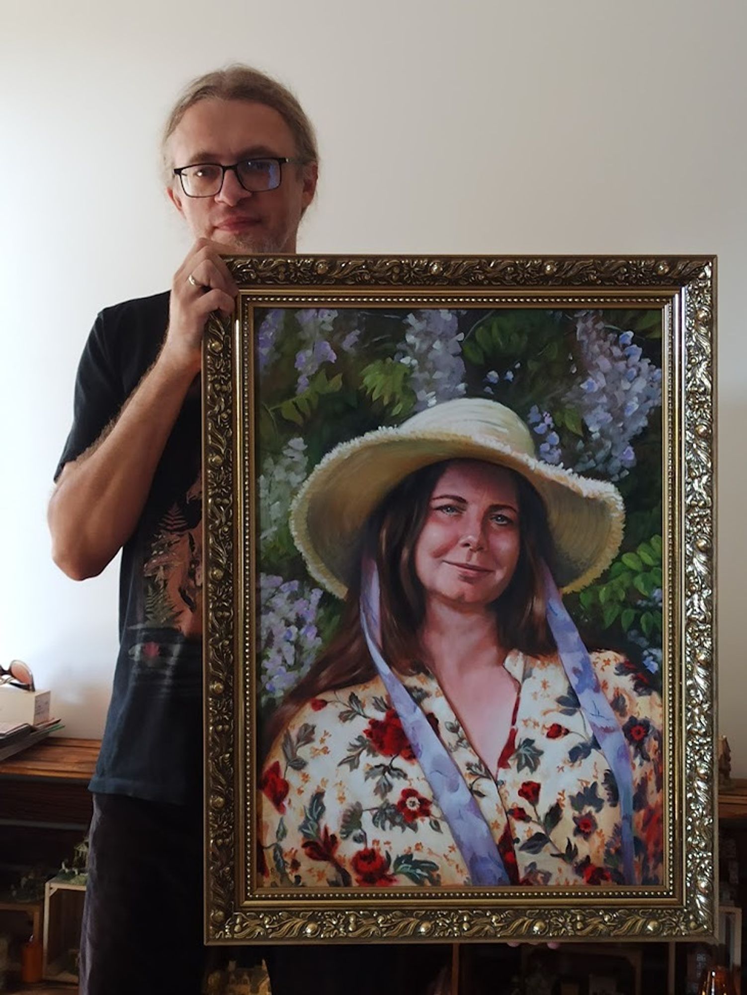 That's me holding the portrait in golden frame.