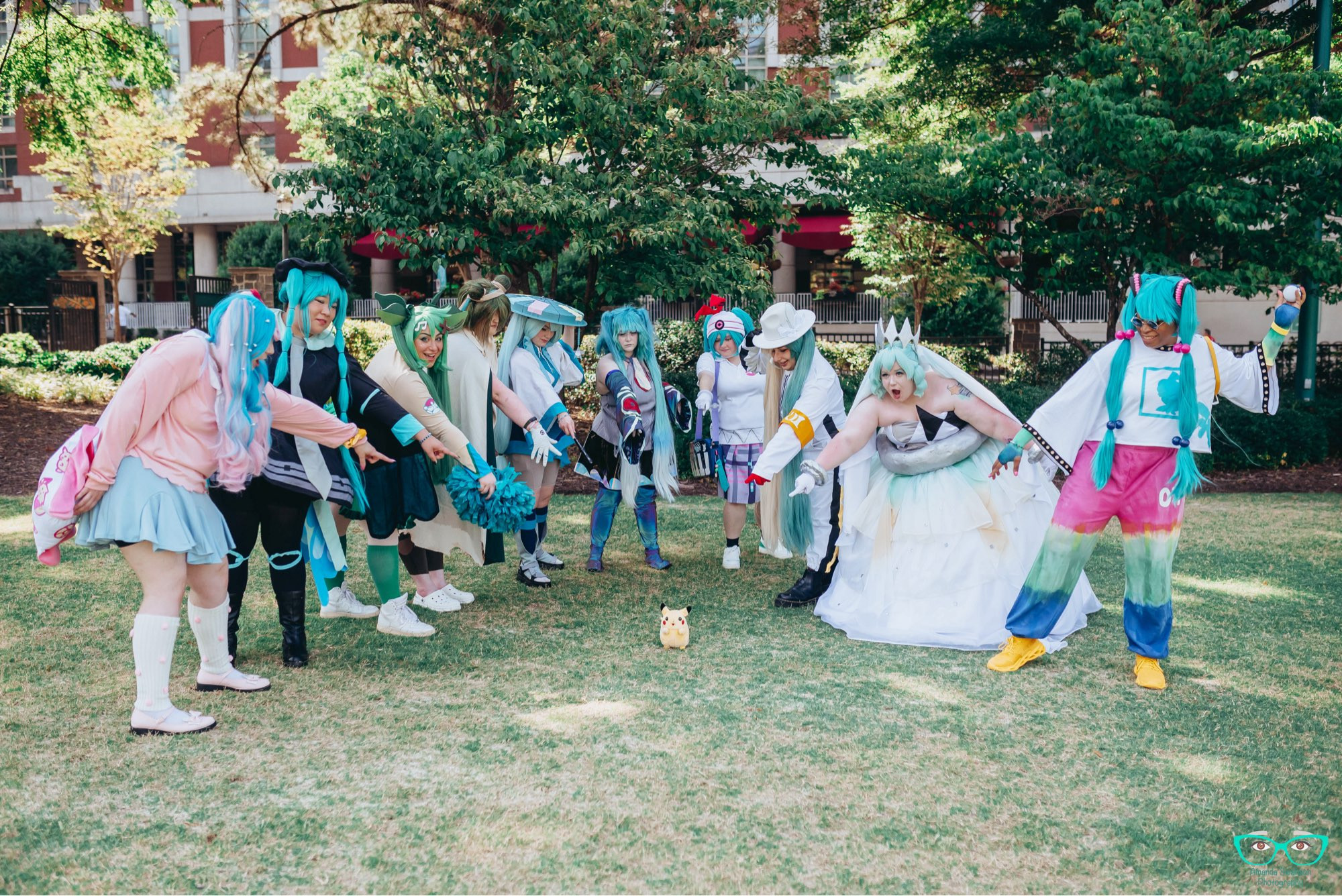 Our group all pointing at a Pikachu plushie