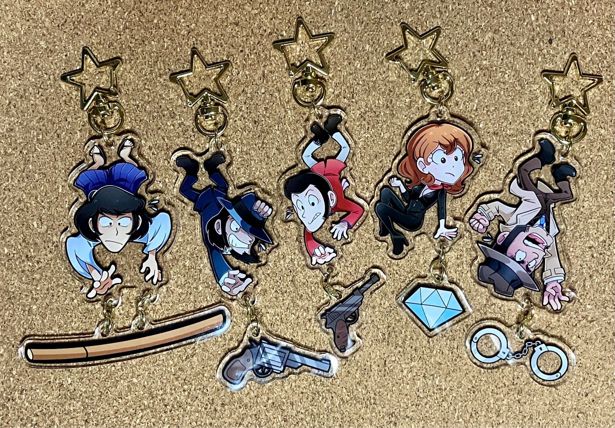 Linked acrylic charms featuring the Lupin III characters.